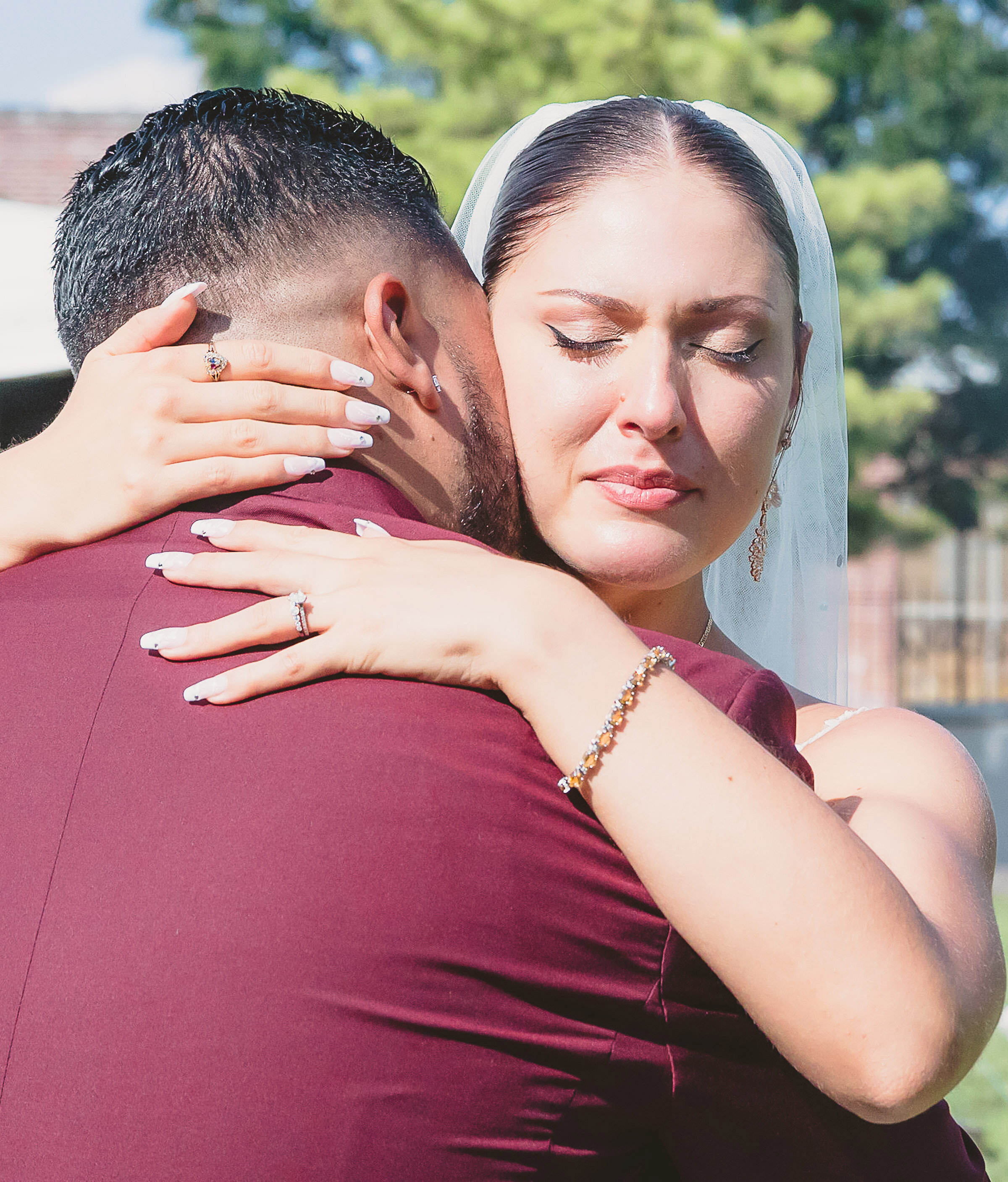 emotional-bride-embracing-her-husband