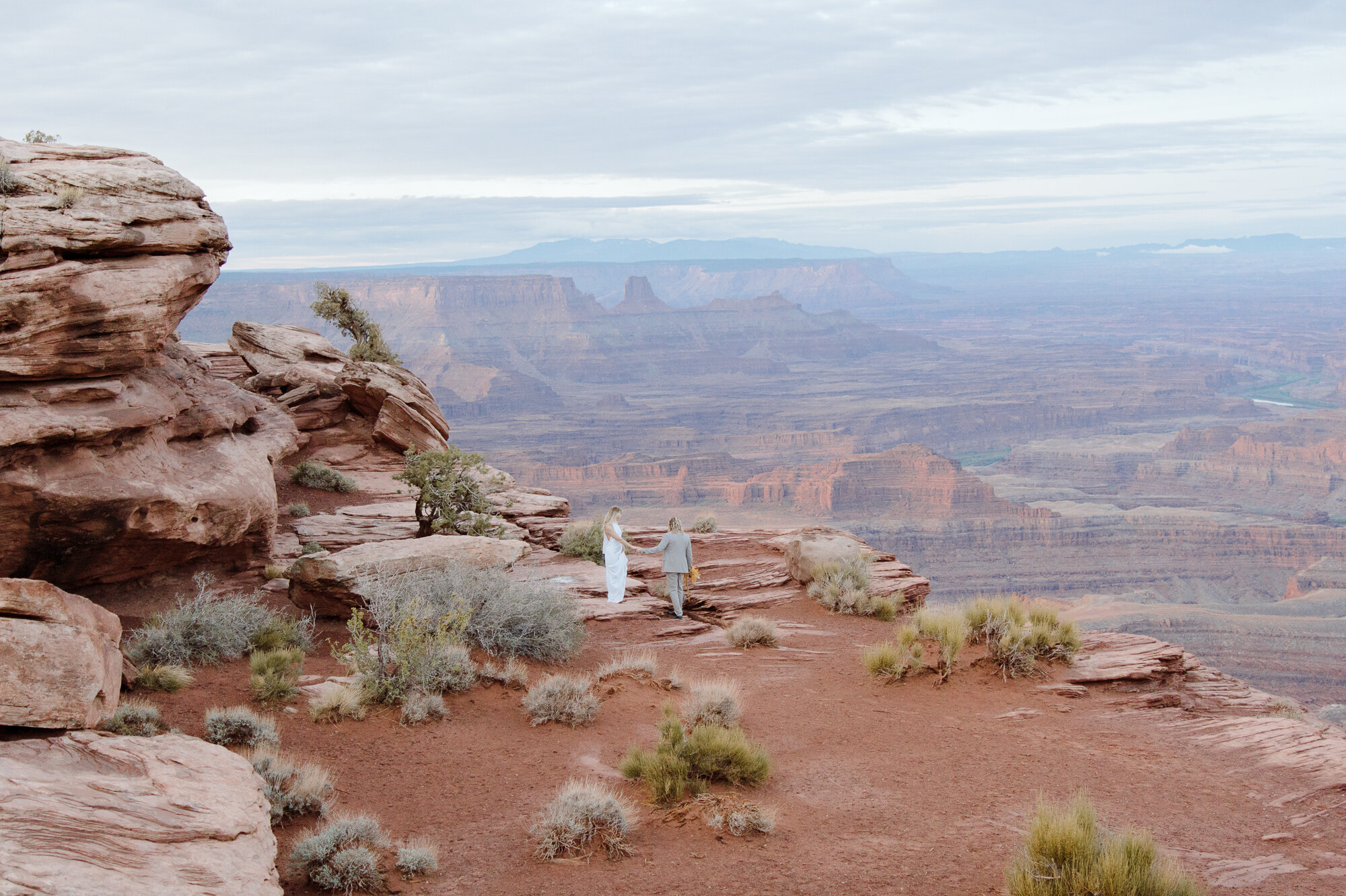 An adventurous couple out on the red rocks of Moab, about to elope
