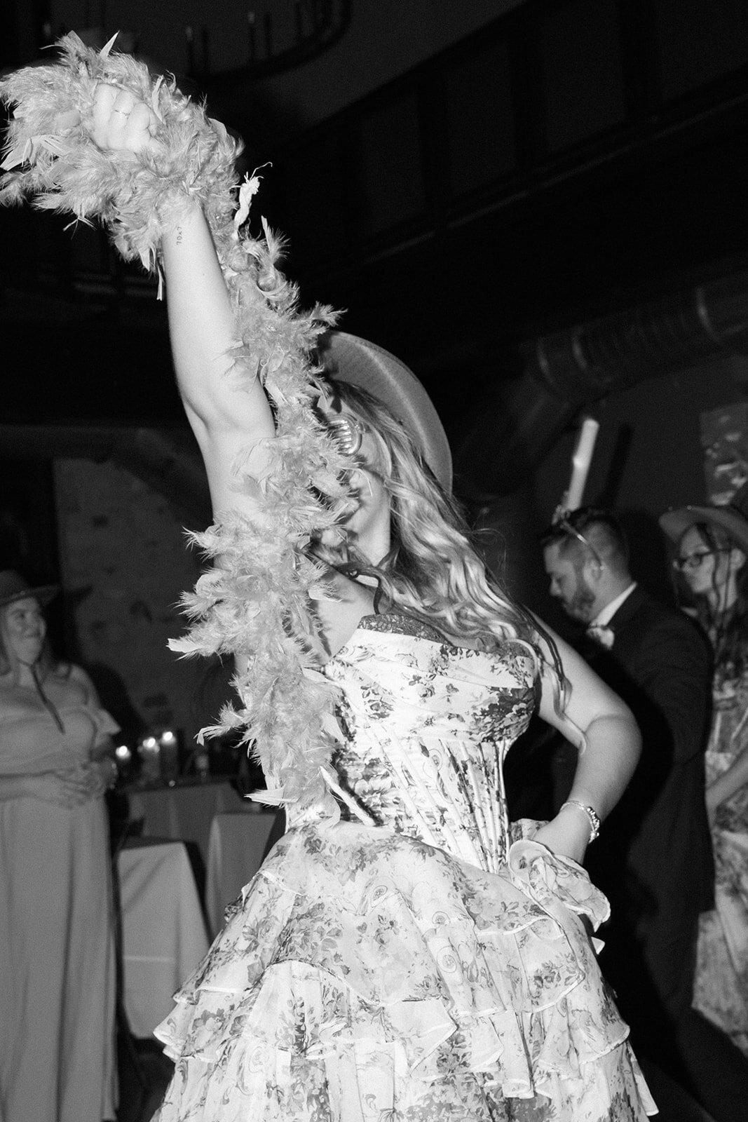 A bridesmaid dancing at the reception.