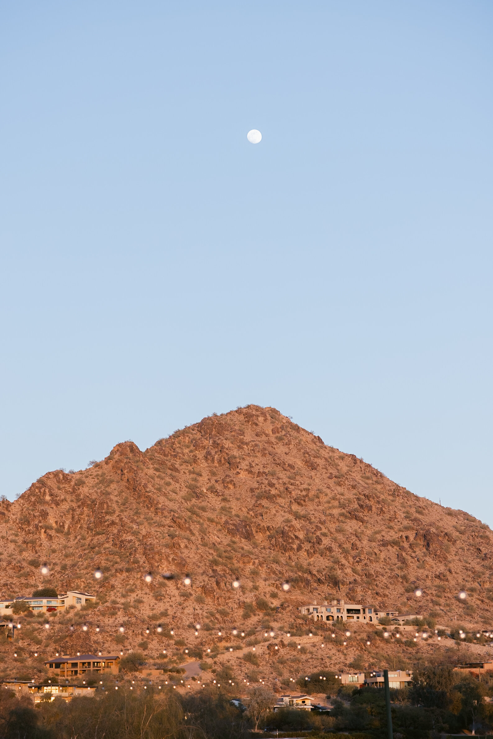sunset with moonrise over camelback mountain in scottsdale