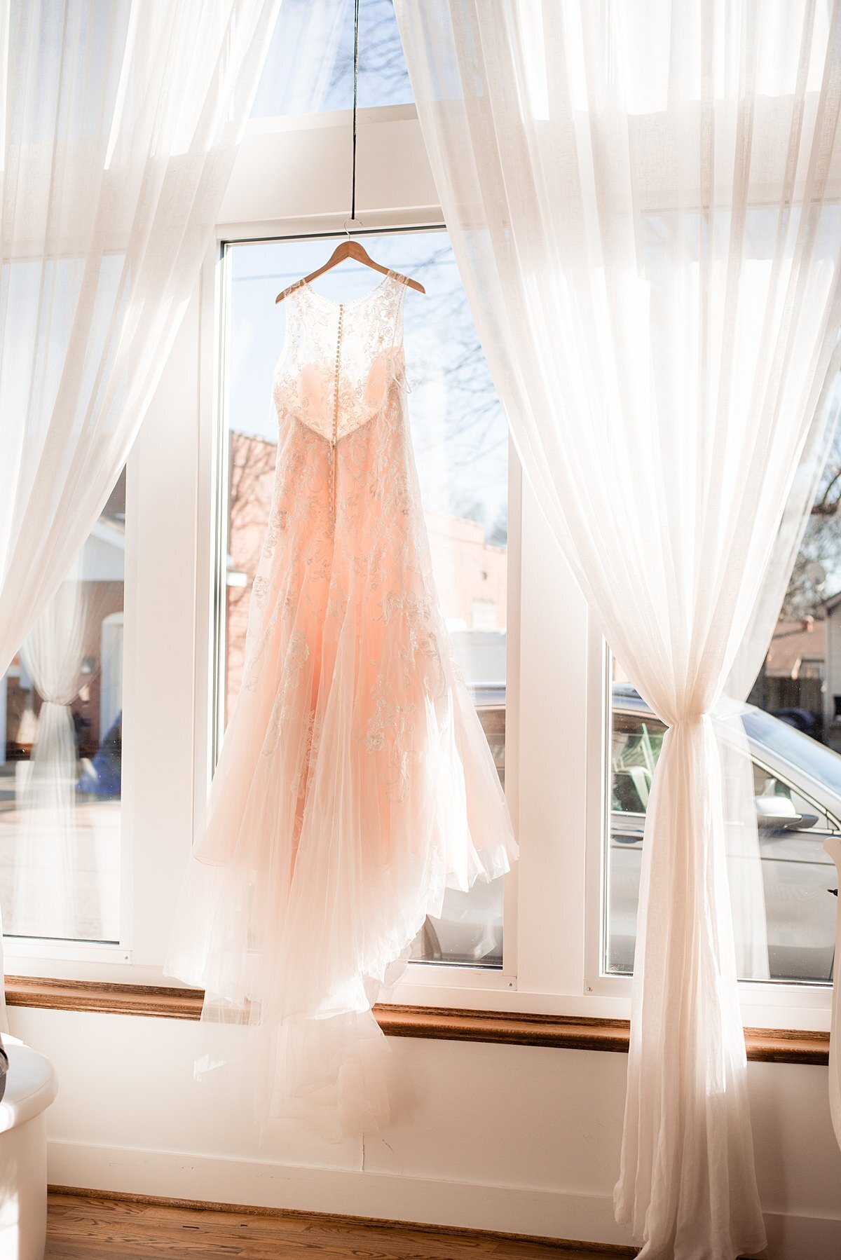 Wedding Dress hanging from window at Wilburn Street Studio
