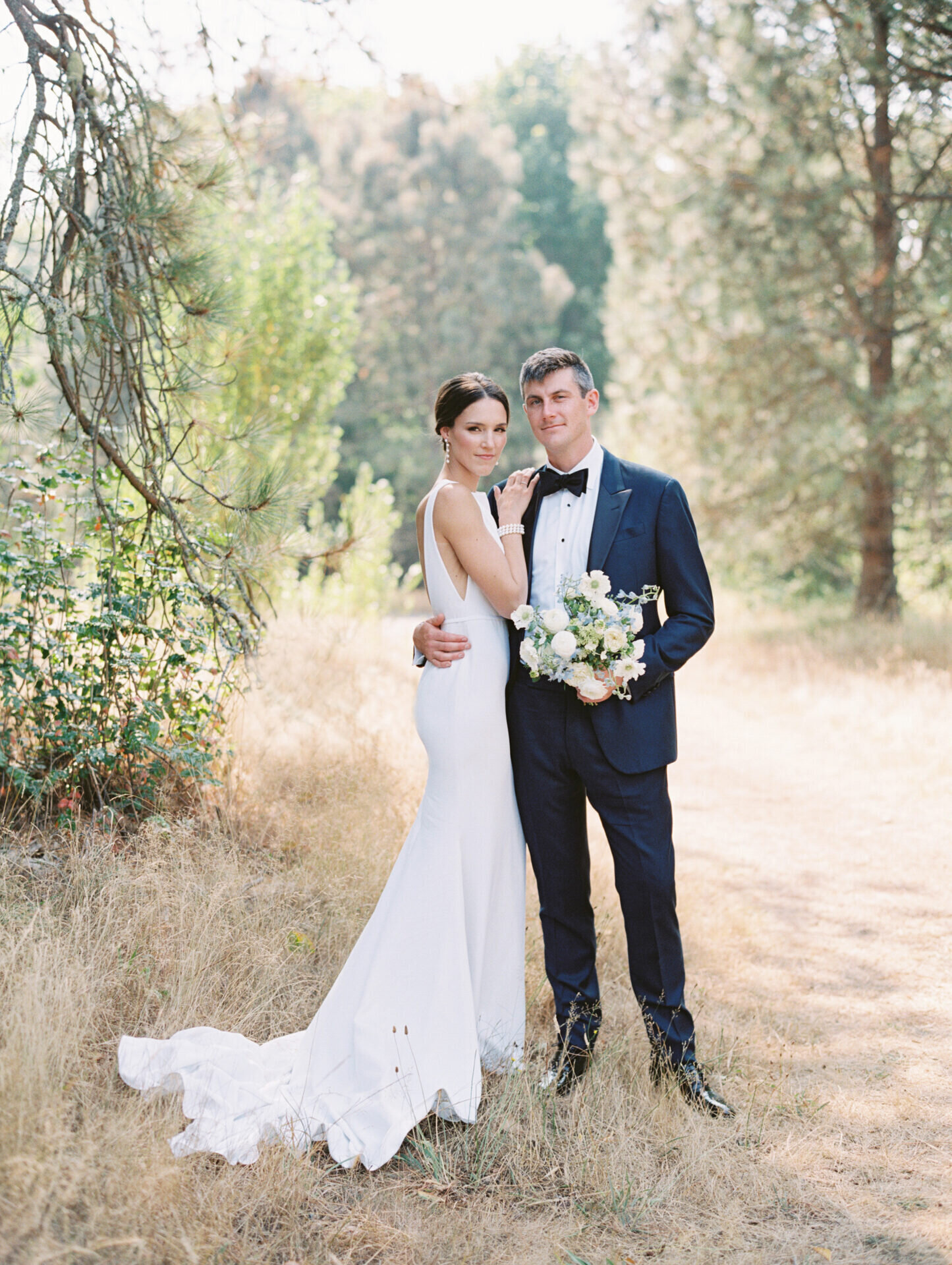 bride and groom posing smiling at camera at discovery park