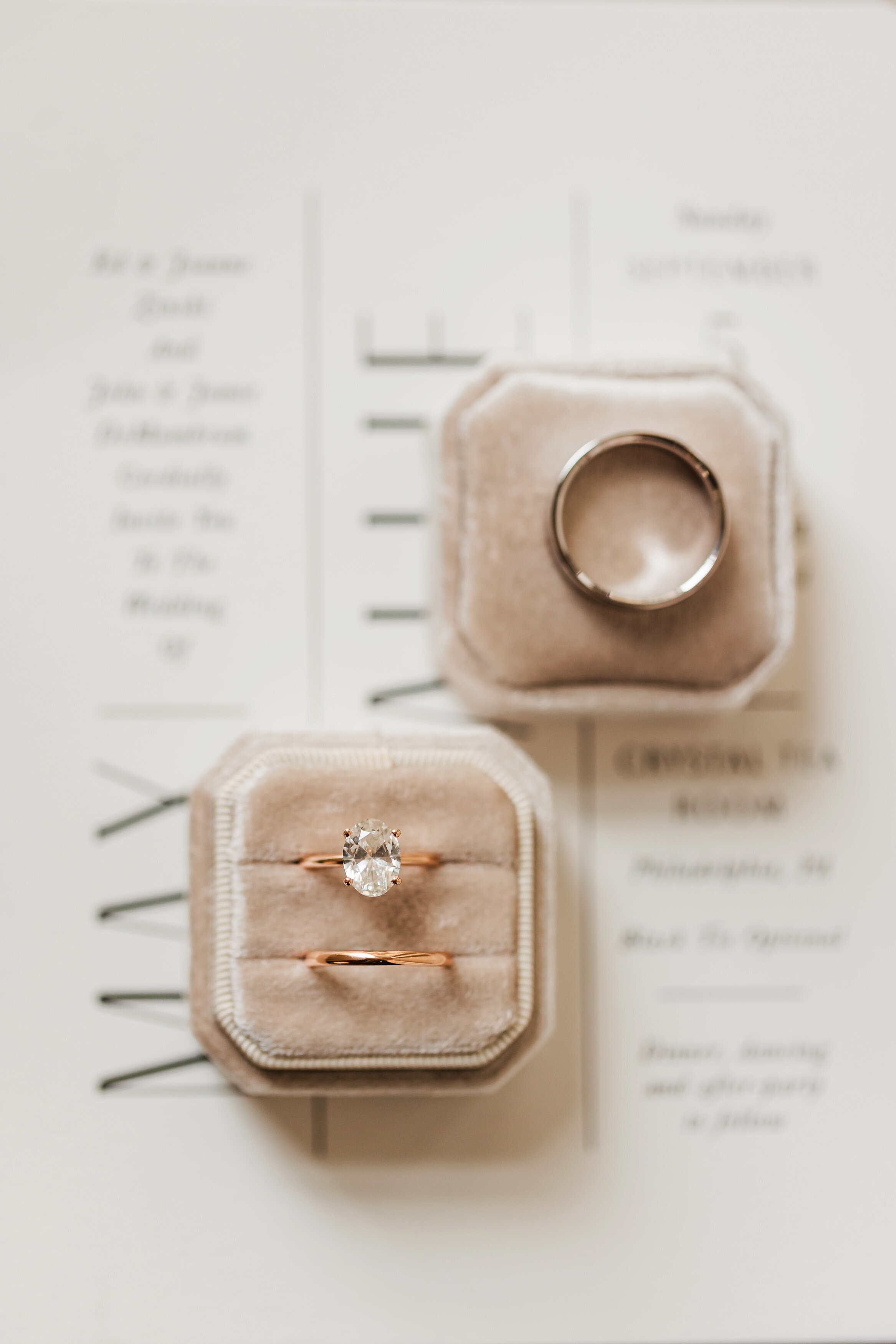 Rode gold wedding bands in a blush velvet ring box  captured at Crystal Tea Room