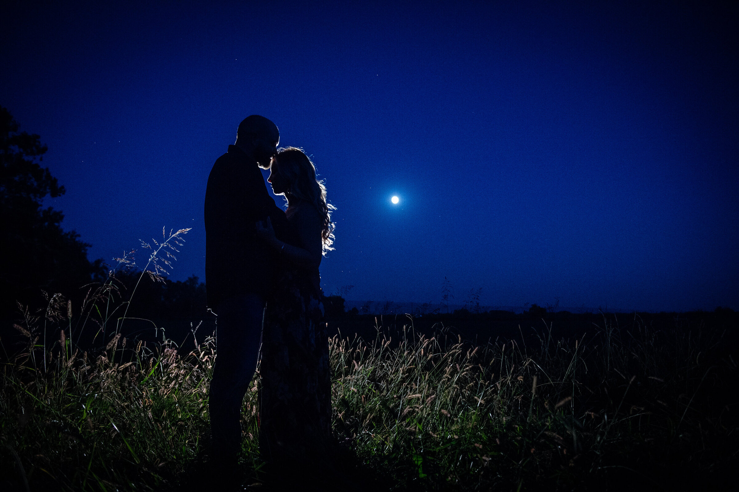 engagement-moon-field-backlit-romantic-intimate-
