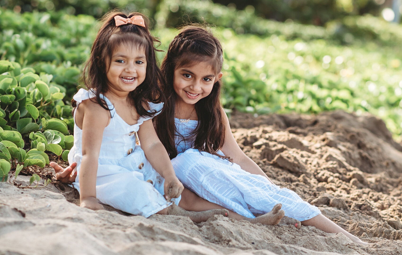Sisters form India meet for the first time in Kauai.  Cute photo they will always remember.