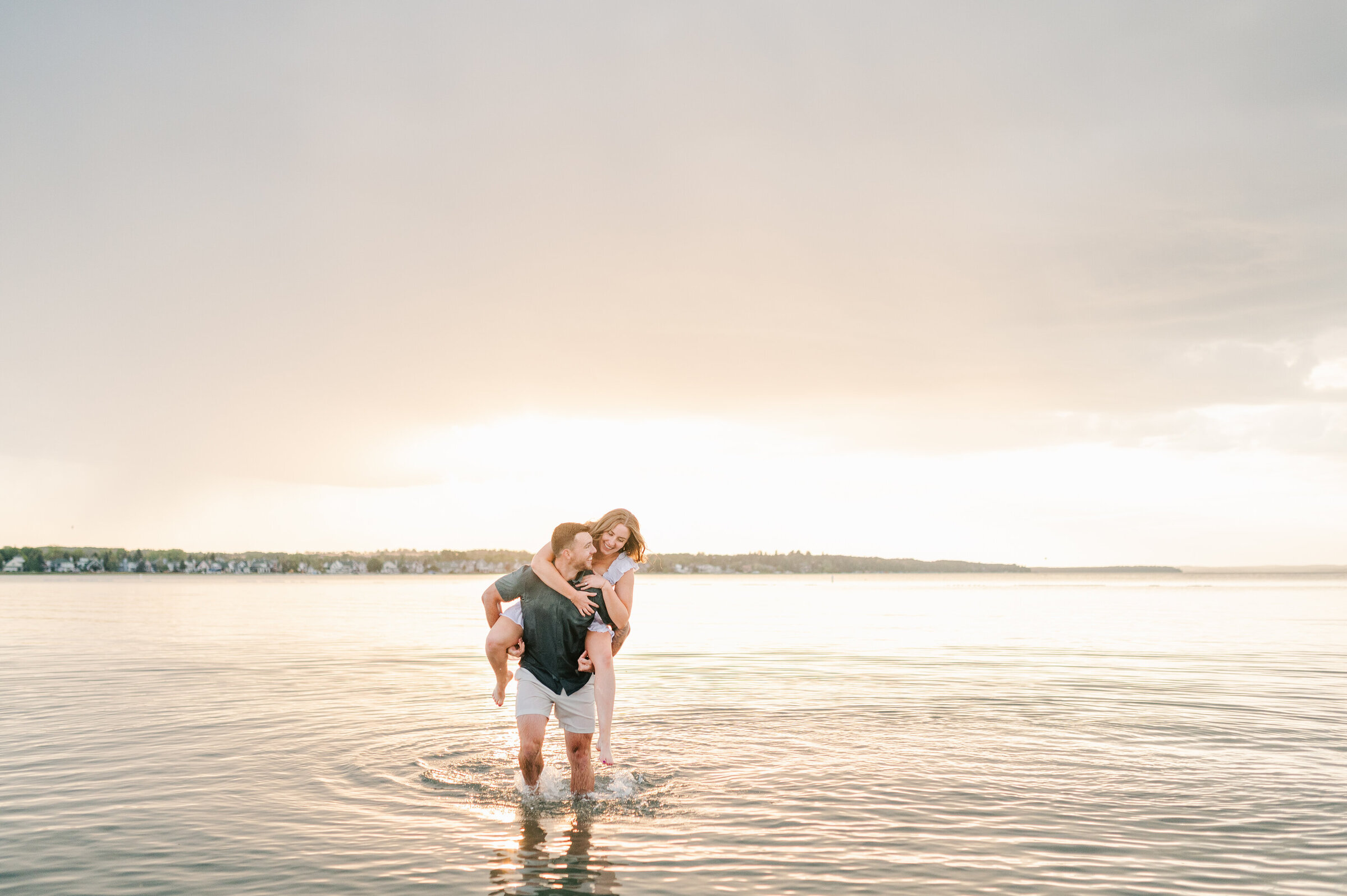 Candid Beach Engagement Photos in Sylvan Lake, Alberta