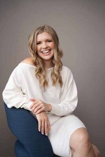 fallback shared on Invalid Date | smiling website designer sitting in chair