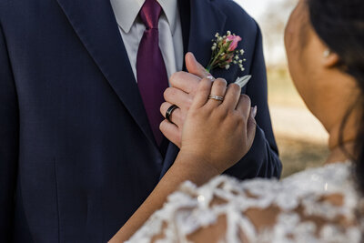 Close up of wedding bands on bride and groom