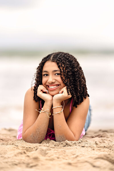 fallback shared on Invalid Date | Senior Girl posing on the sand  iconic Space Coast Cocoa Beach Florida. Senior girl is l...
