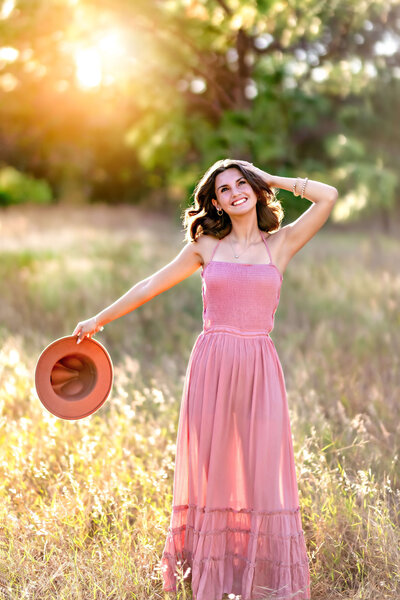 fallback shared on Invalid Date | Golden hour sunset senior photos captured senior girl twirling in the beautiful fields o...
