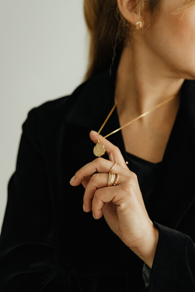 kaboompics_jewelry-photo-shoot-woman-wearing-gold-rings-and-necklace-29247