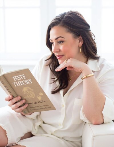 freepik__ashleyc-is-reading-a-book-titled-feste-theory-she-__96786