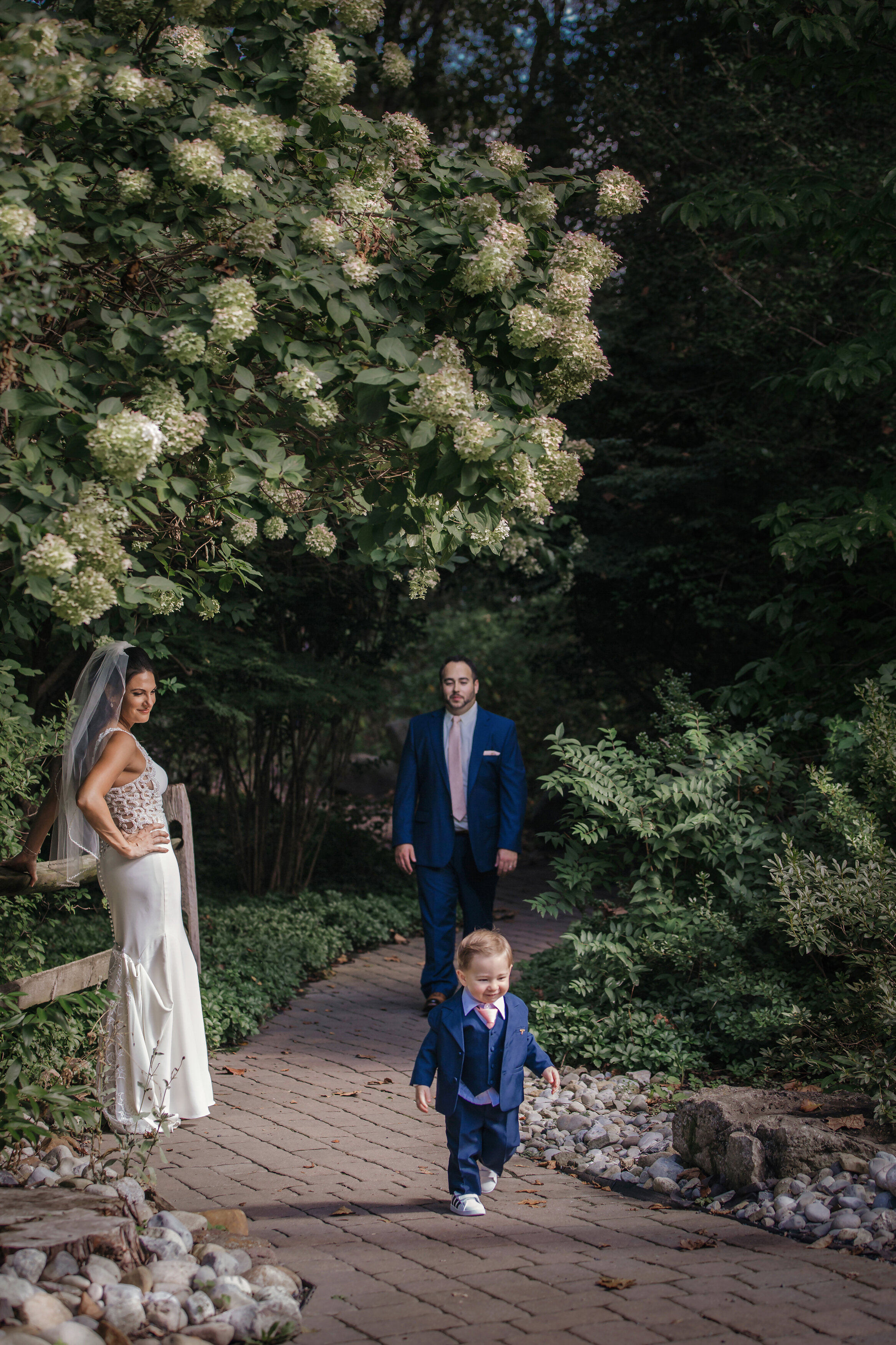 Bride and groom have family picture taken by NJ wedding photographer
