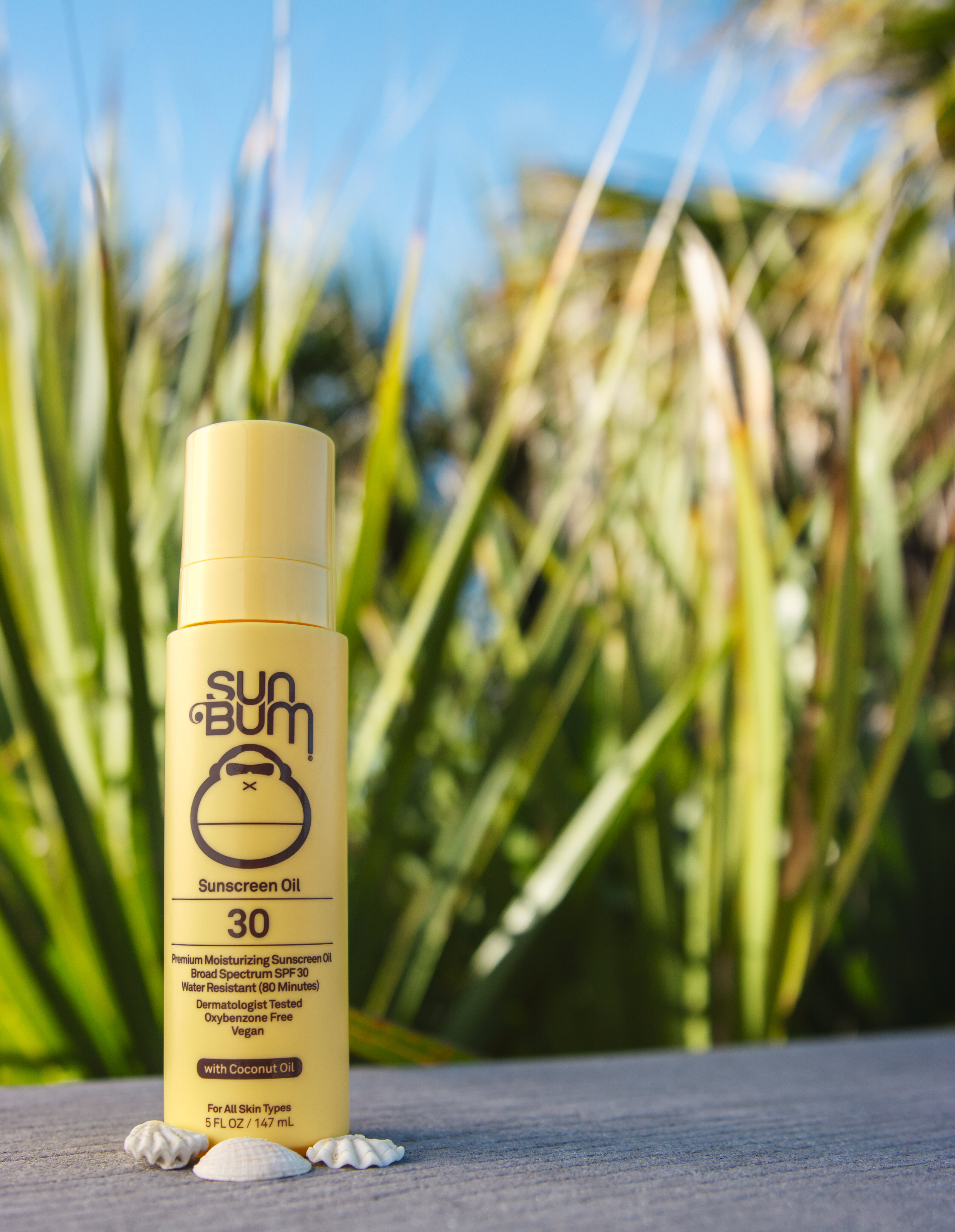 SunBum sunscreen photographed outdoors in natural light