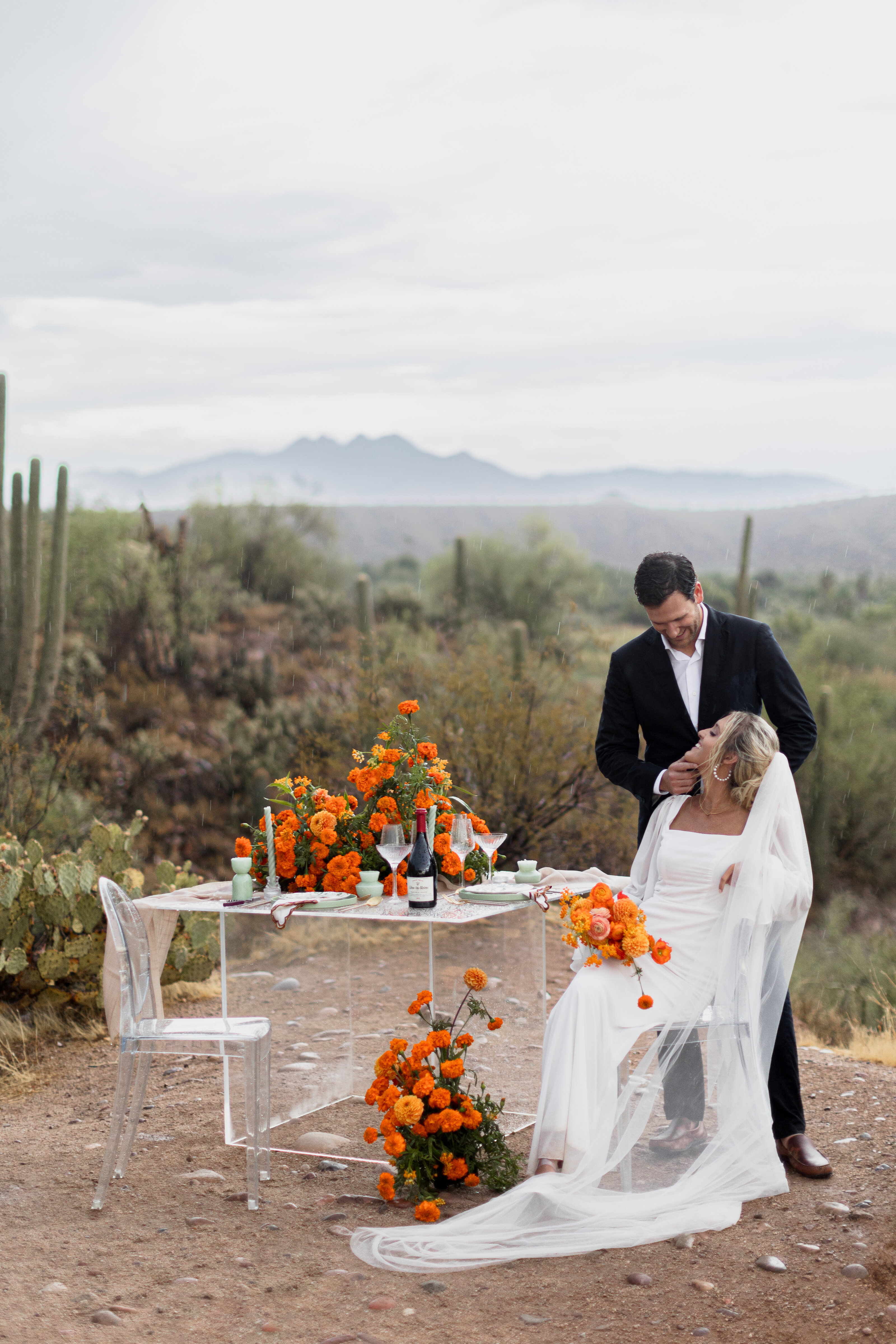 wedding couple newlywed photos with orange floral at salt river elopement