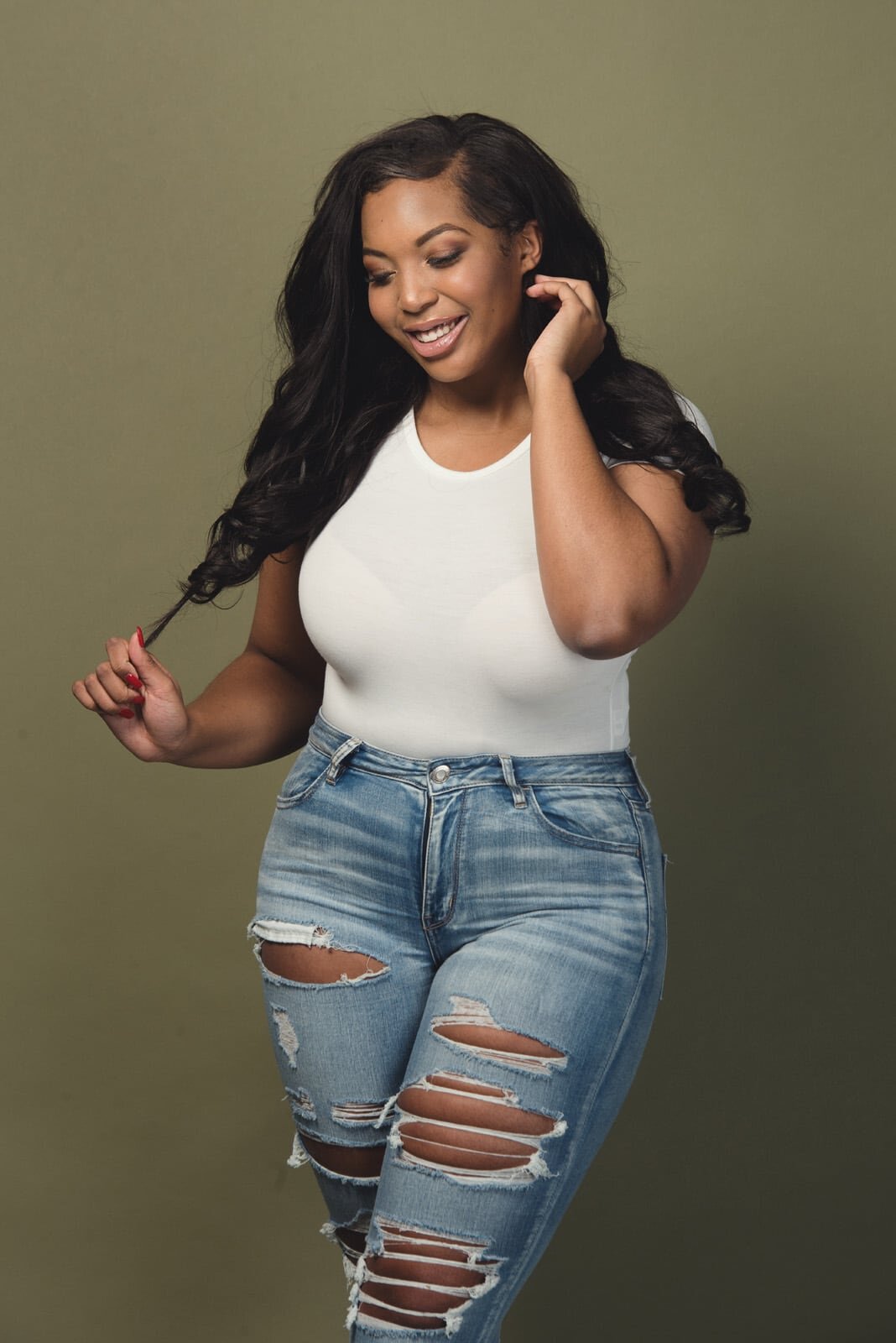 Confident Woman in Trendy Ripped Jeans-11