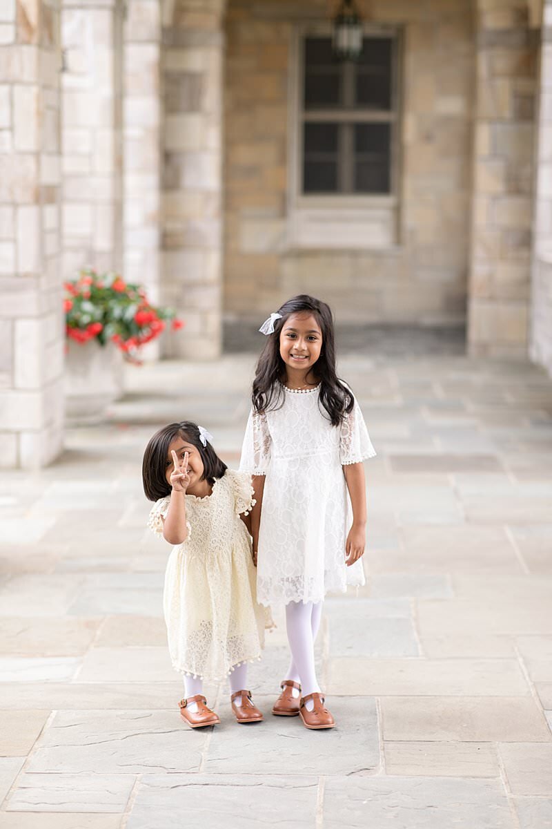 Two little girls in white dresses for Maryland Family Photography session