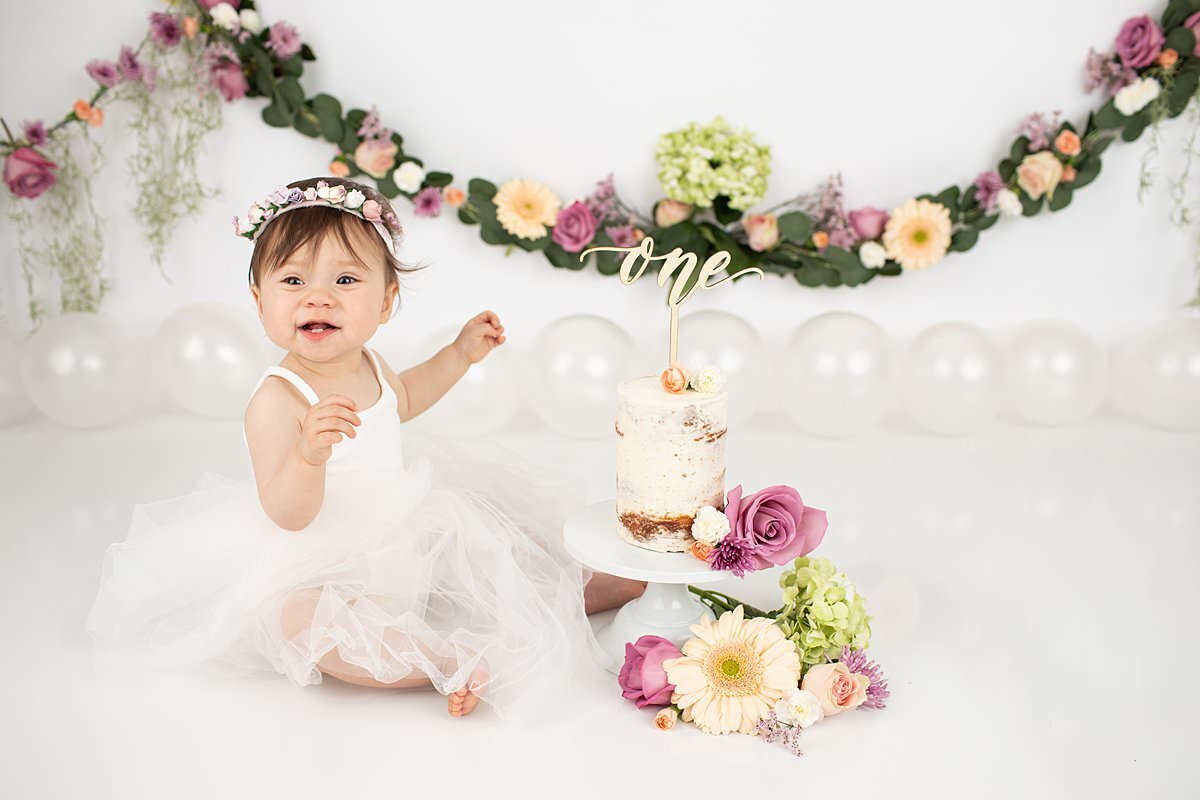 1st birthday photoshoot with flowers and garland by Maryland Portrait Photographer : Rebecca Leigh Photography