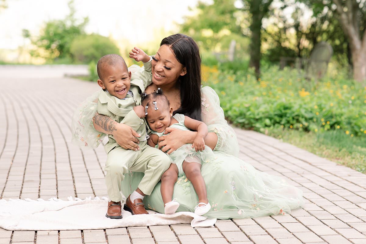 Mom cuddling little boy and girl for Maryland Family Photographer
