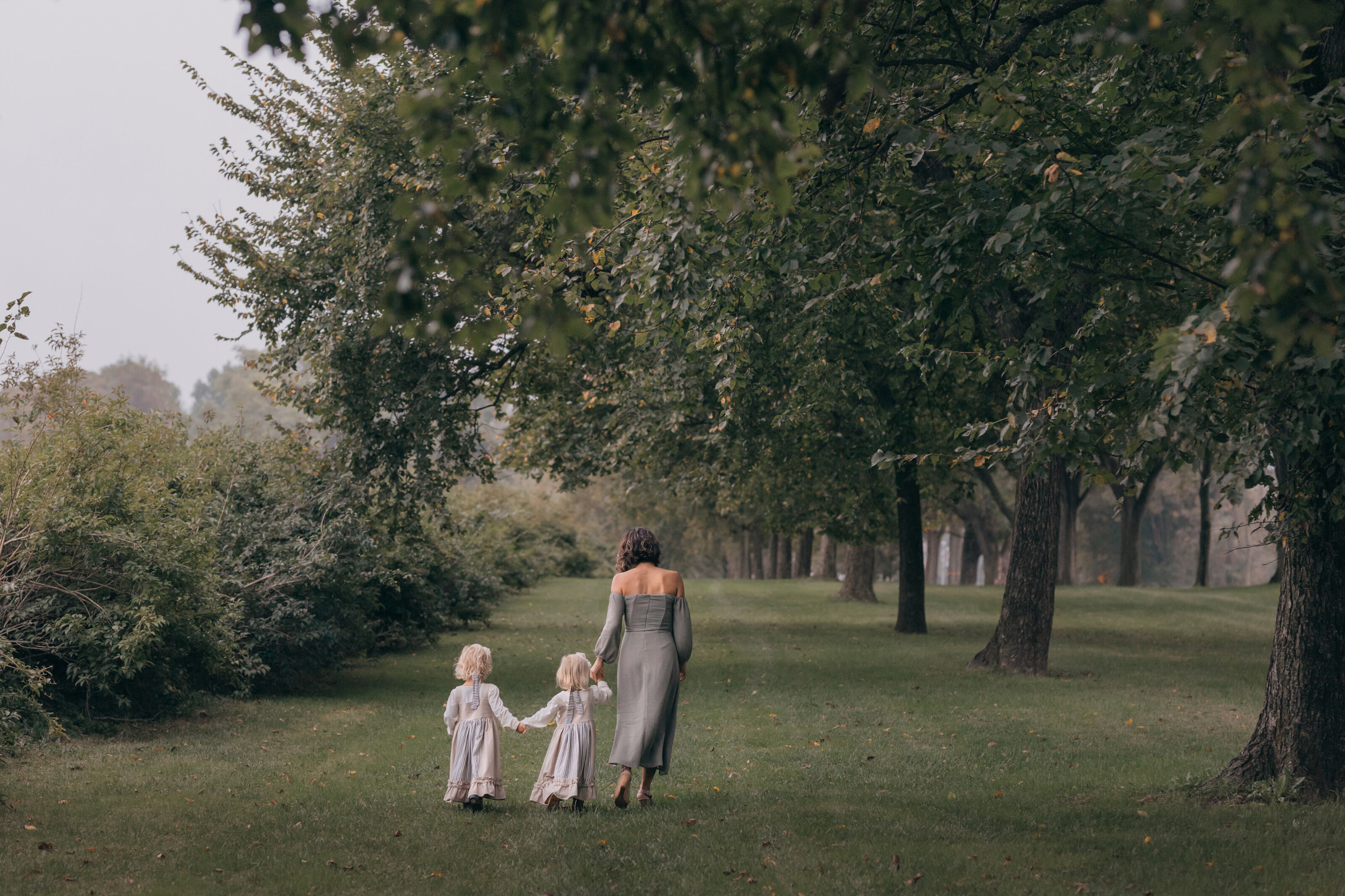 mother and kids walking during family photography photo shoot in Princeton, New Jersey