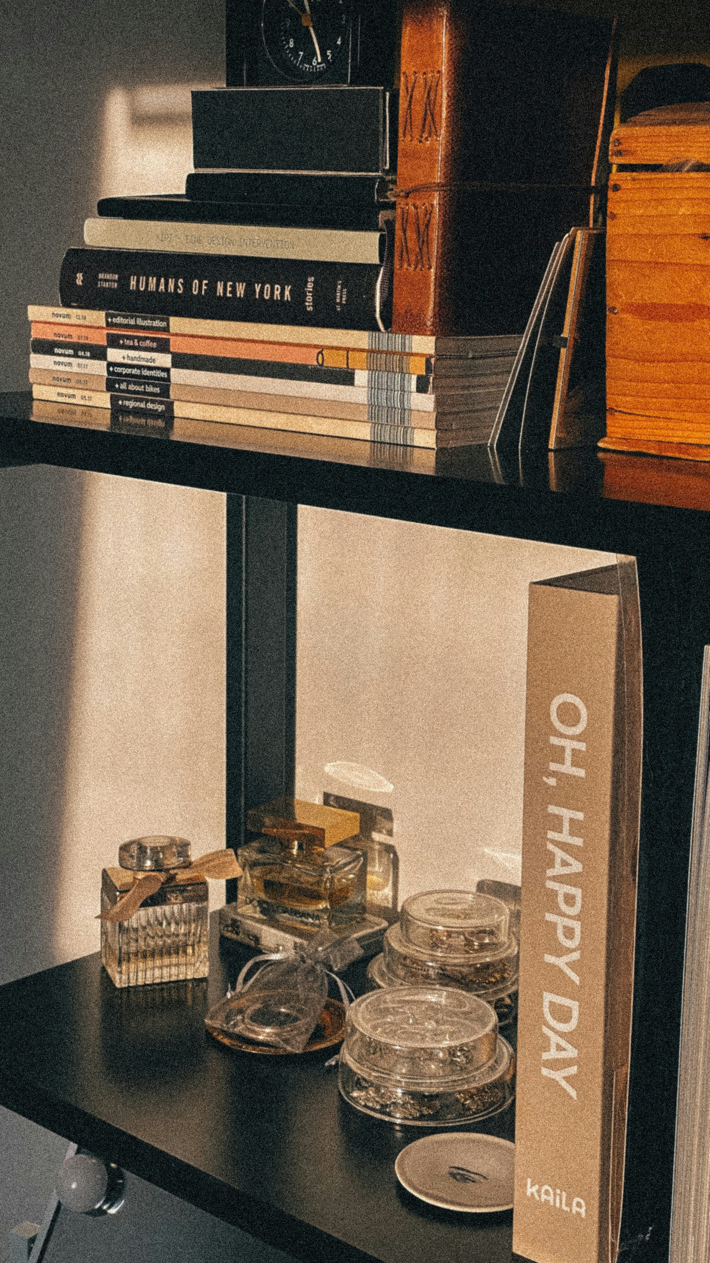 Books and alcohol sitting on a bar cart