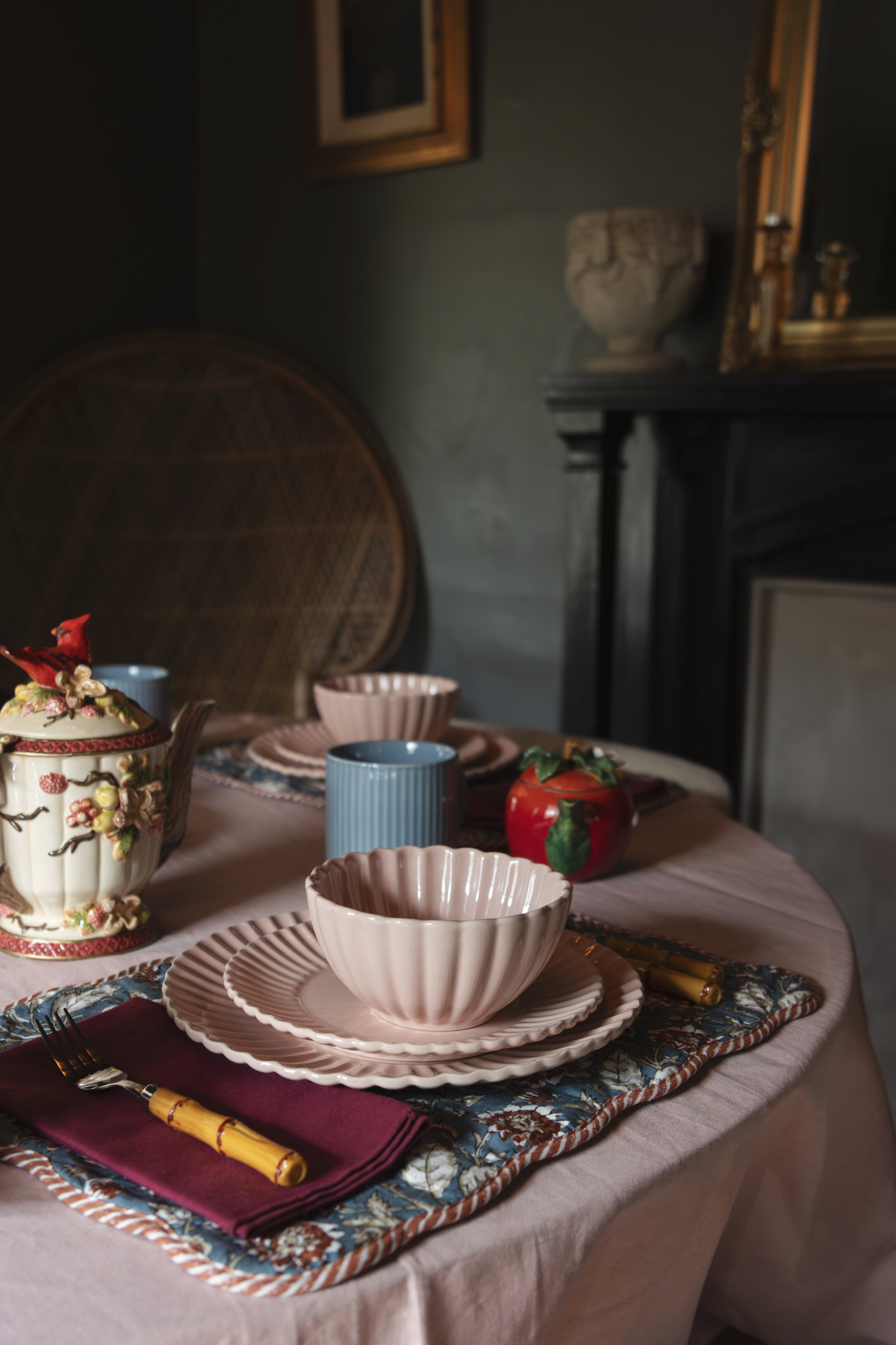 Styled tablescape featuring dishes, mugs and silverware for a product shoot