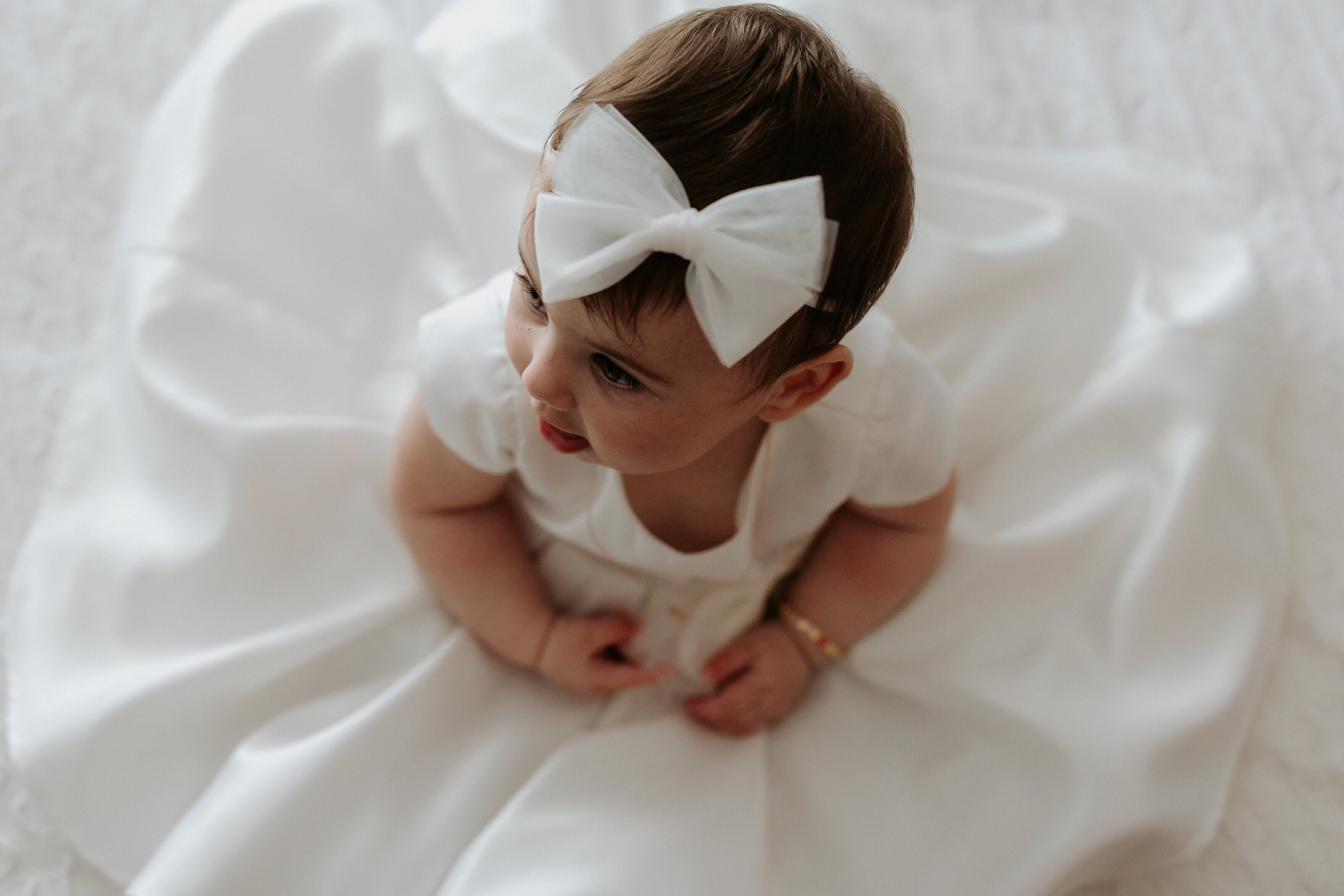 Elegant christening gown details captured in a Perth baptism session