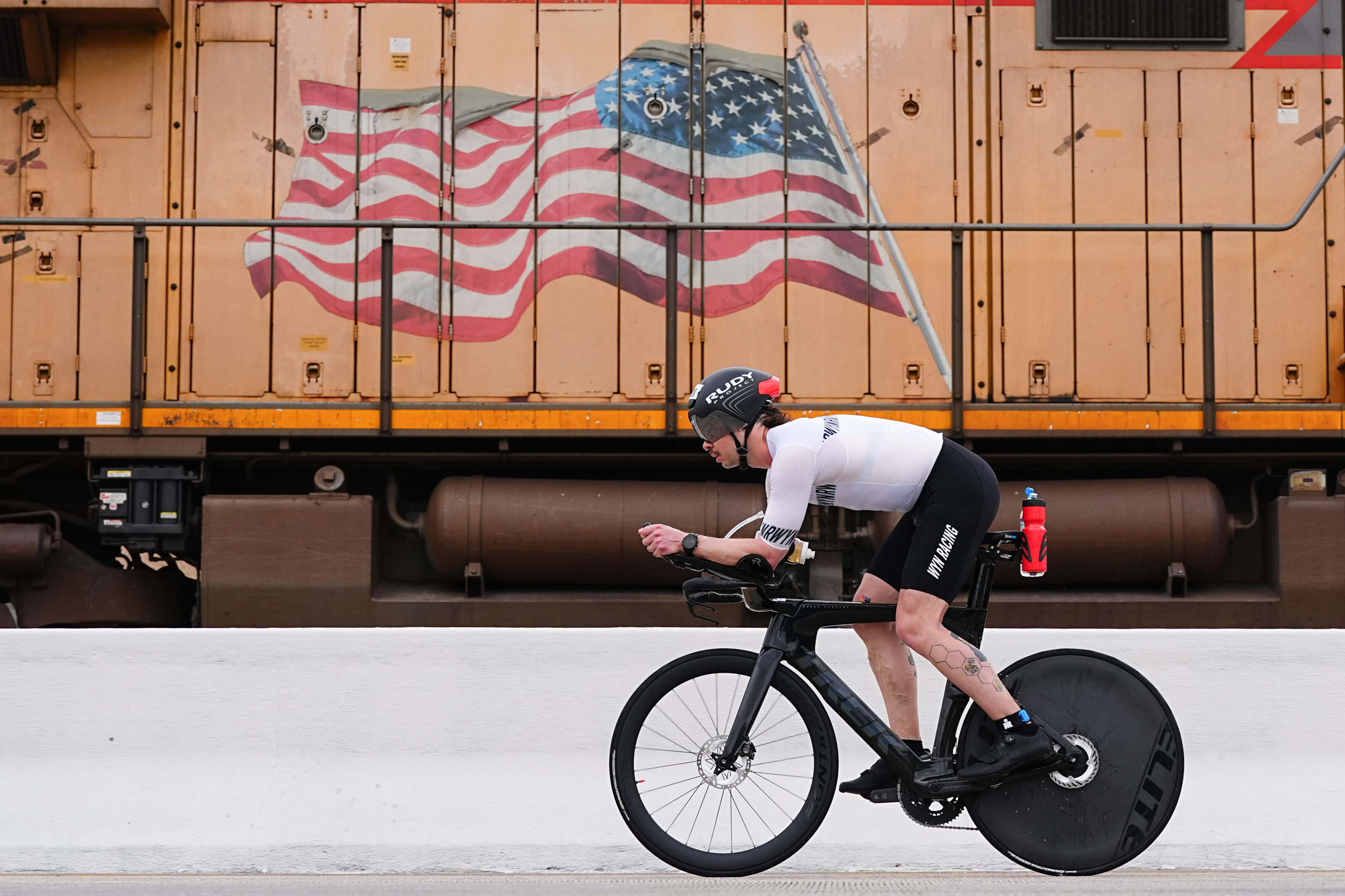 kansas-city-sports-photography-0135-cyclist-passing-moving-freight-train