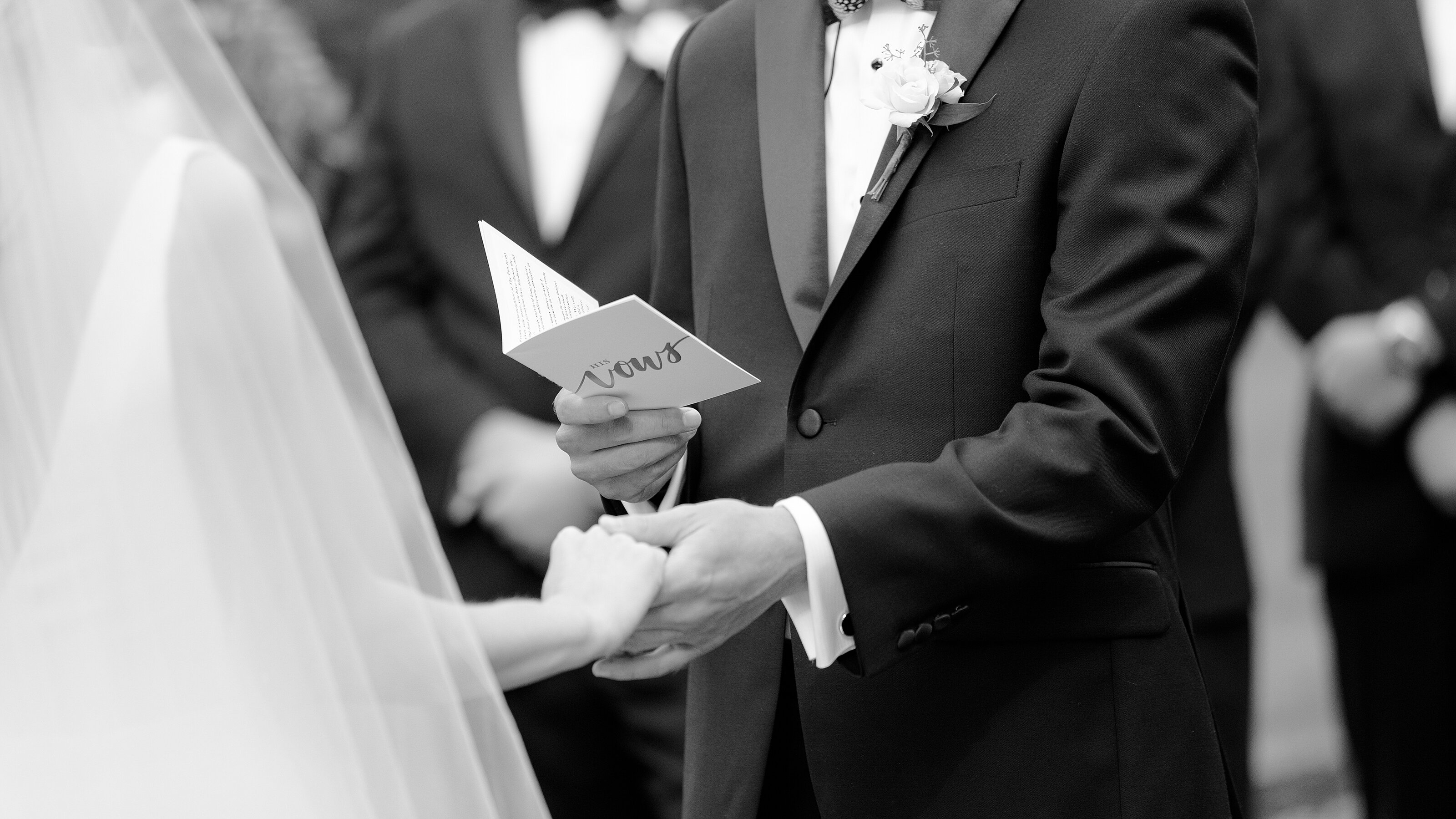 8_bride-and-groom-hold-hands-as-groom-reads-his-vows