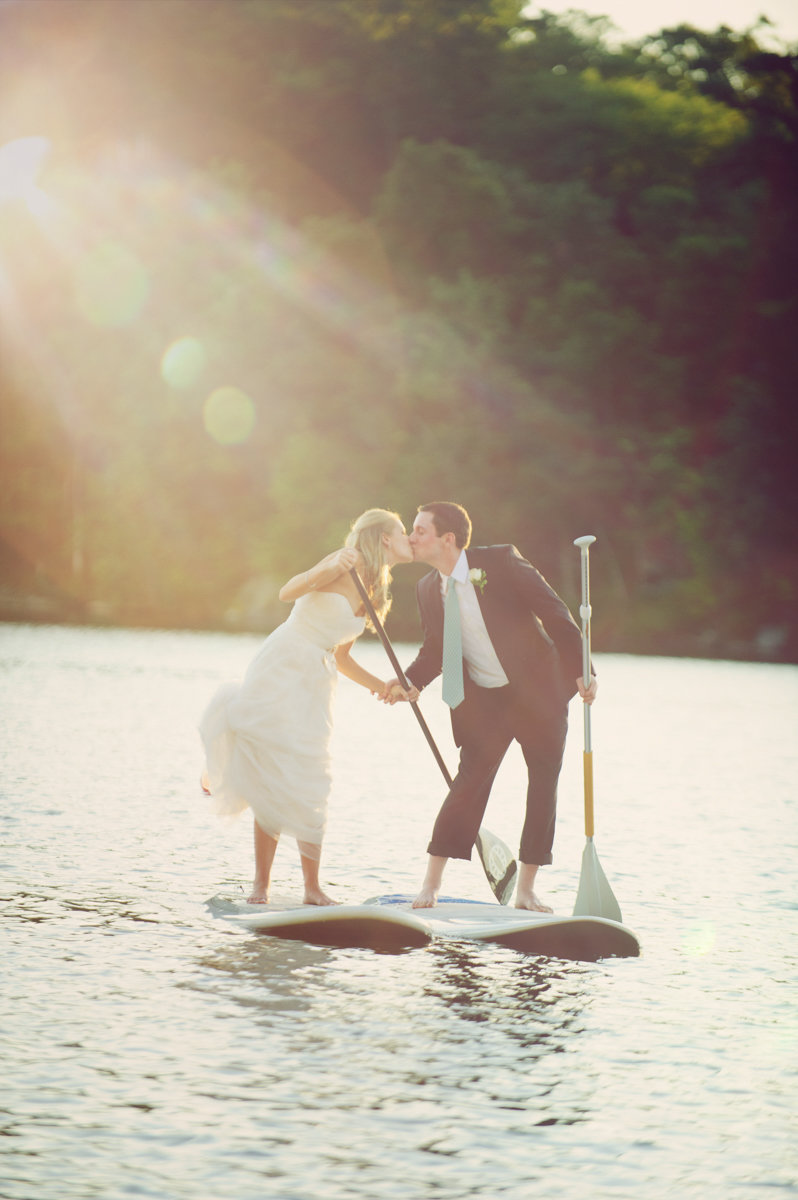 natural adventurous couple wanderlust paddle board unique wedding day kiss lake jersey shore beach golden hour
