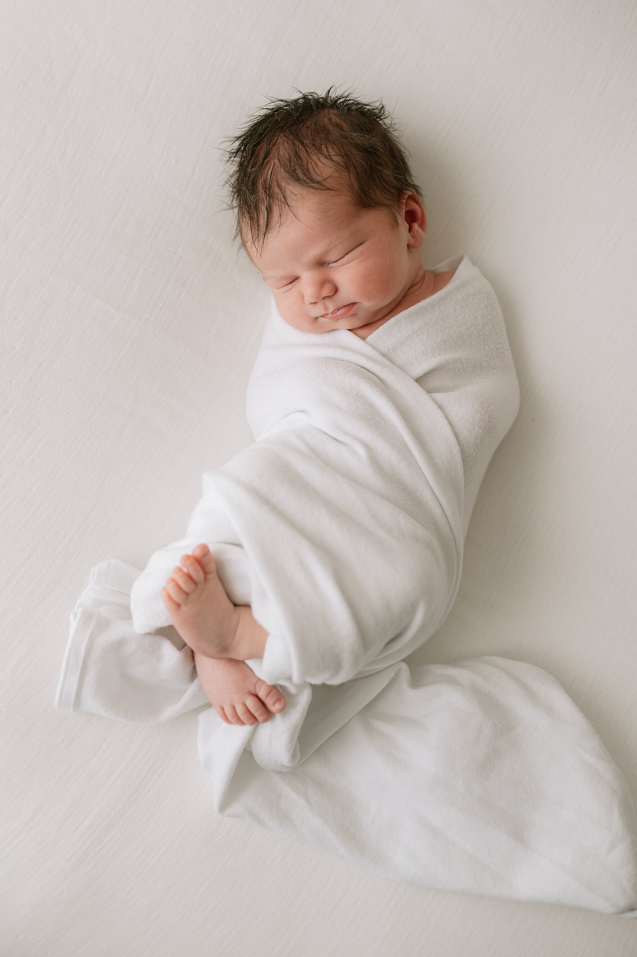 york newborn baby being photographed by a maternity, baby and newborn photographer