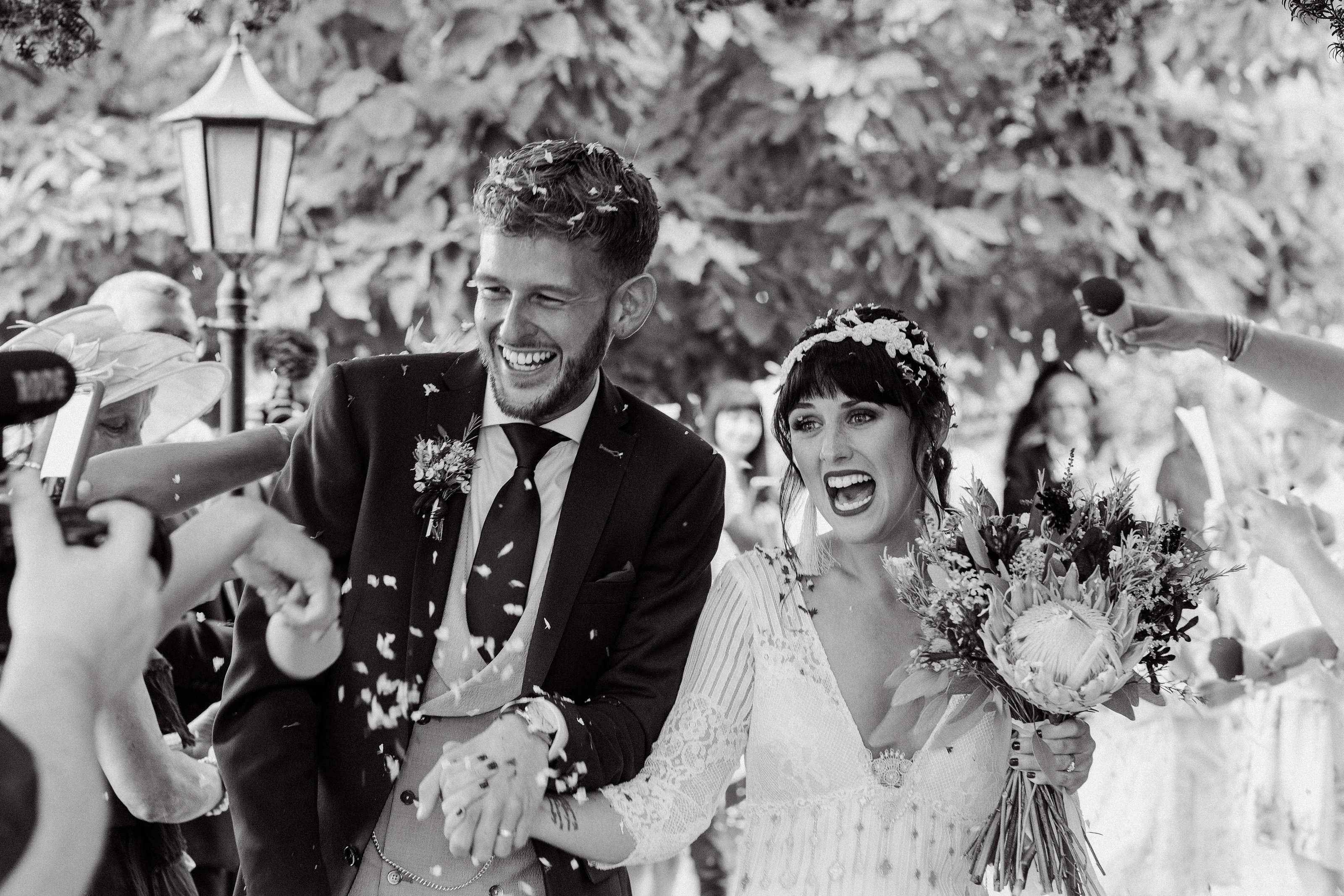 Adorlee Photography captures a very excited bride and groom during a confetti throw