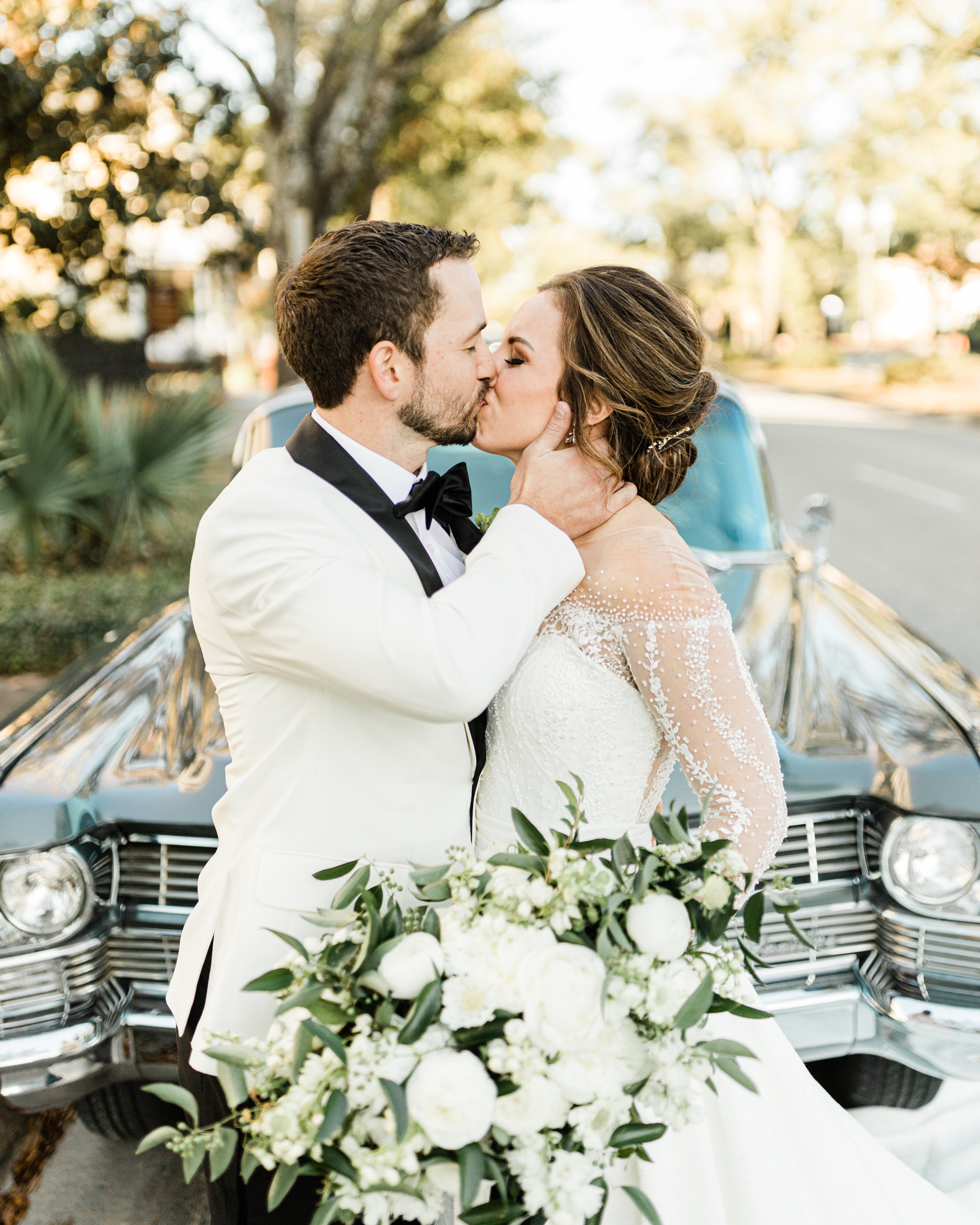 White tuxedo with a winter wedding dress.