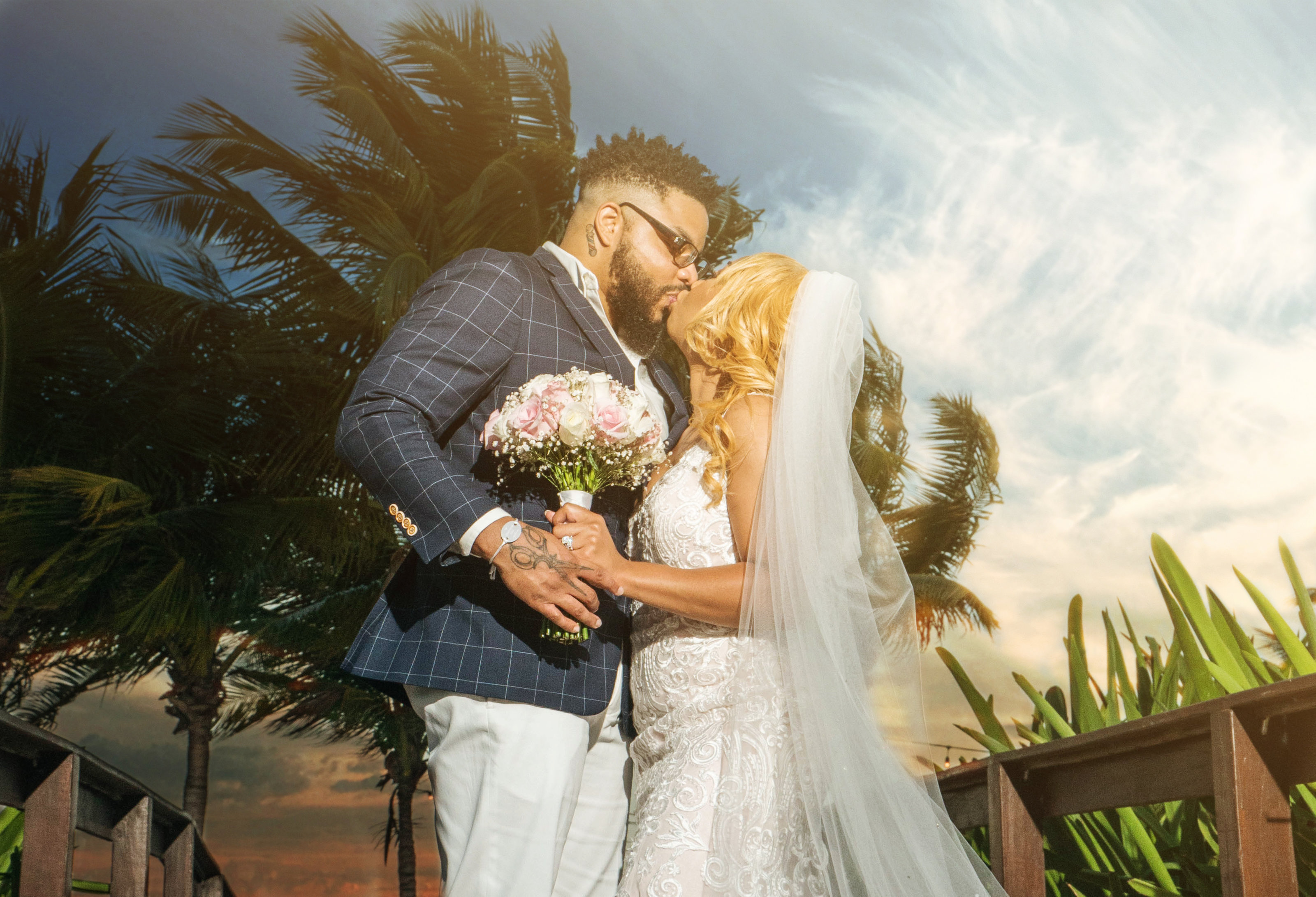 kissing black couple on the beach Wedding Photographer in Cancun