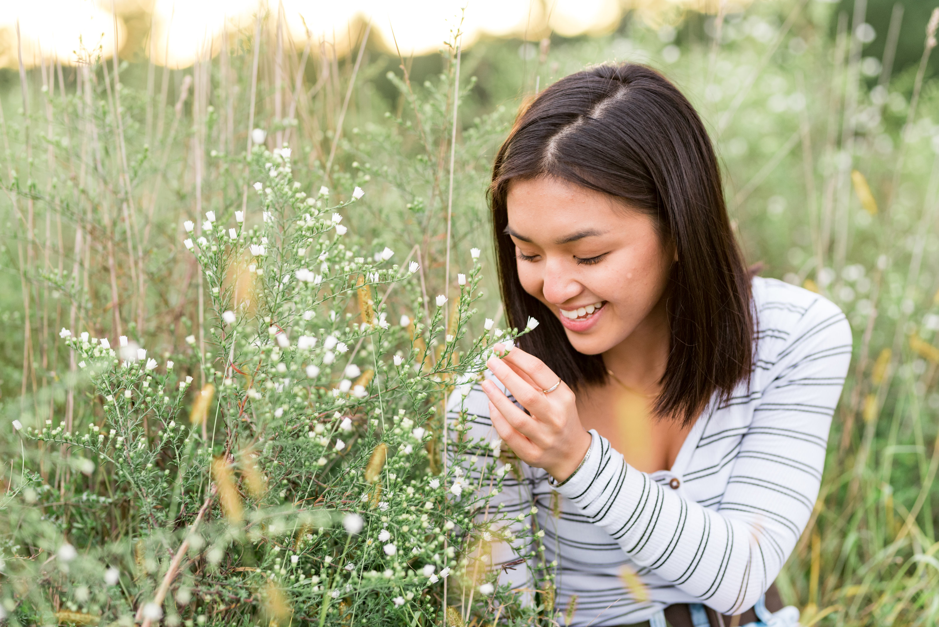 Girl Smelling Flowers