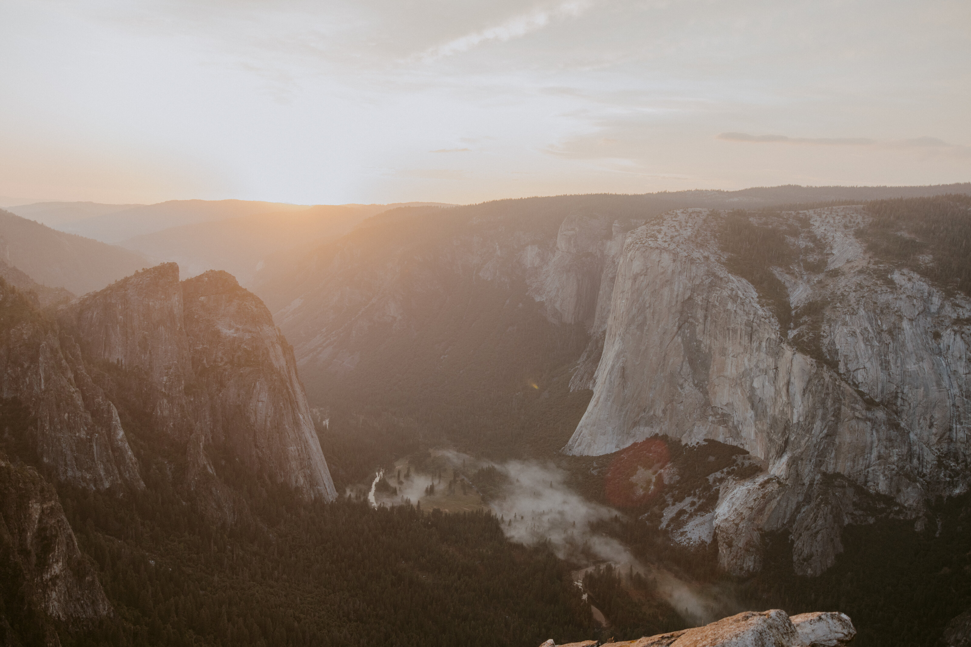 Yosemite bride overlooking valley at sunrise after elopement