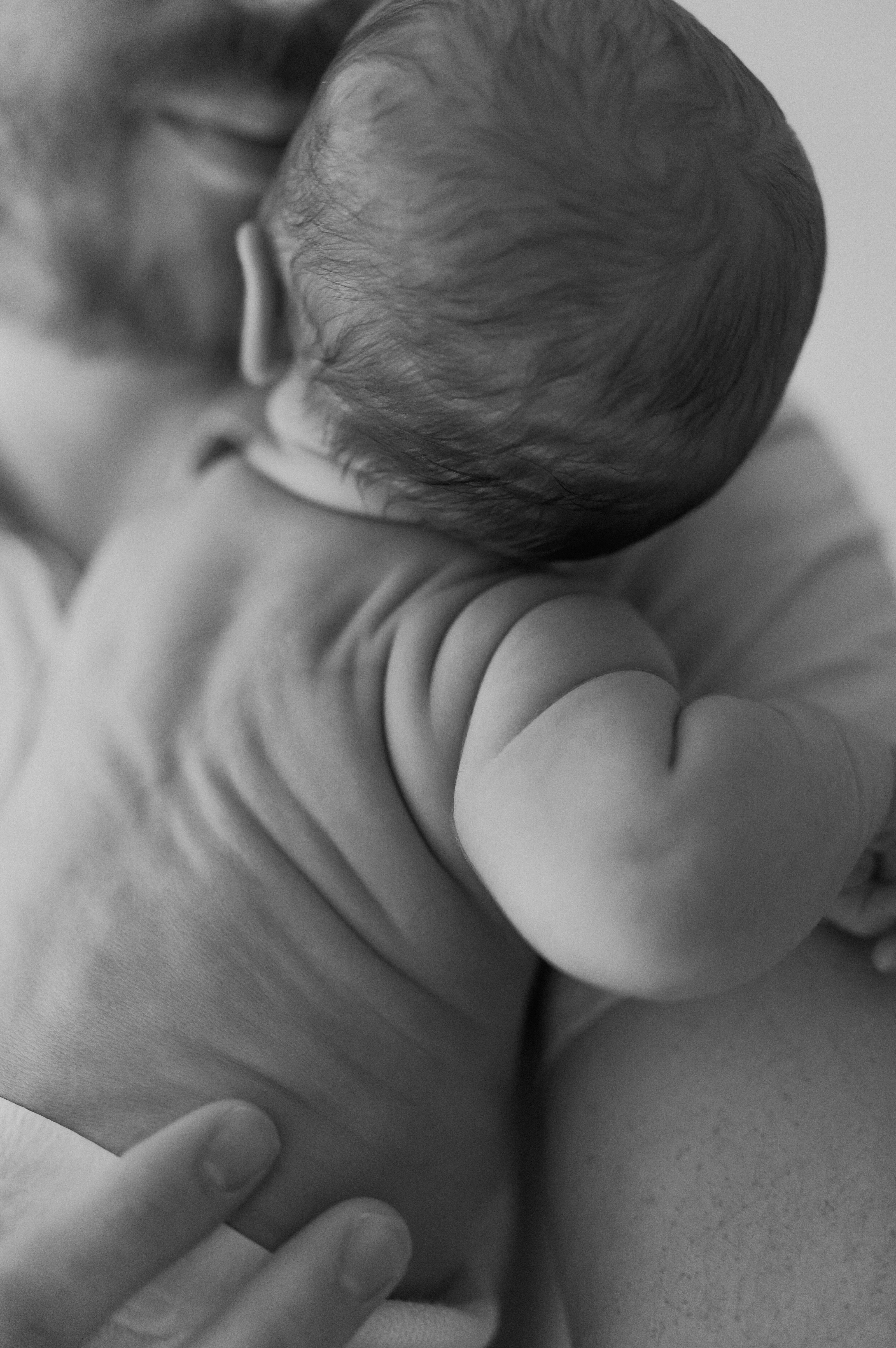 close up of baby boy on Dads shoulder in York studio