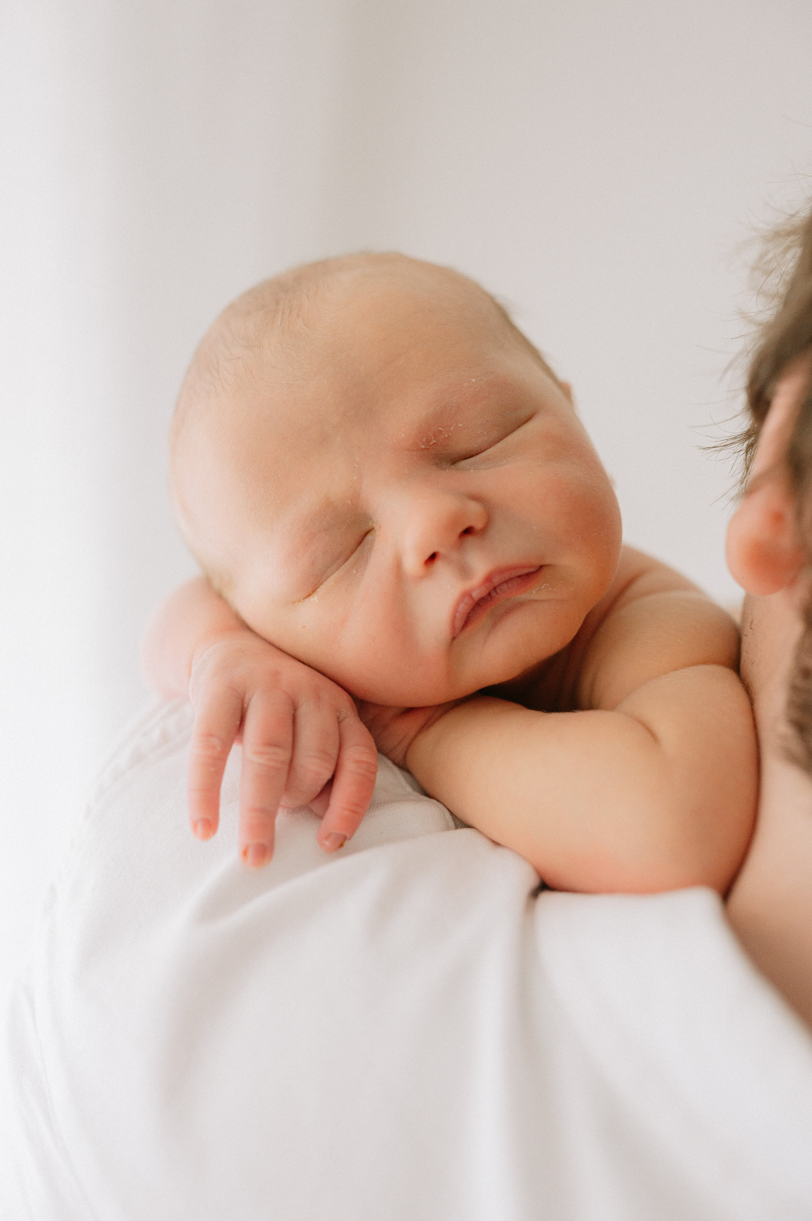 close up of baby boy on Dads shoulder at studio in central York, servicing Yorkshire