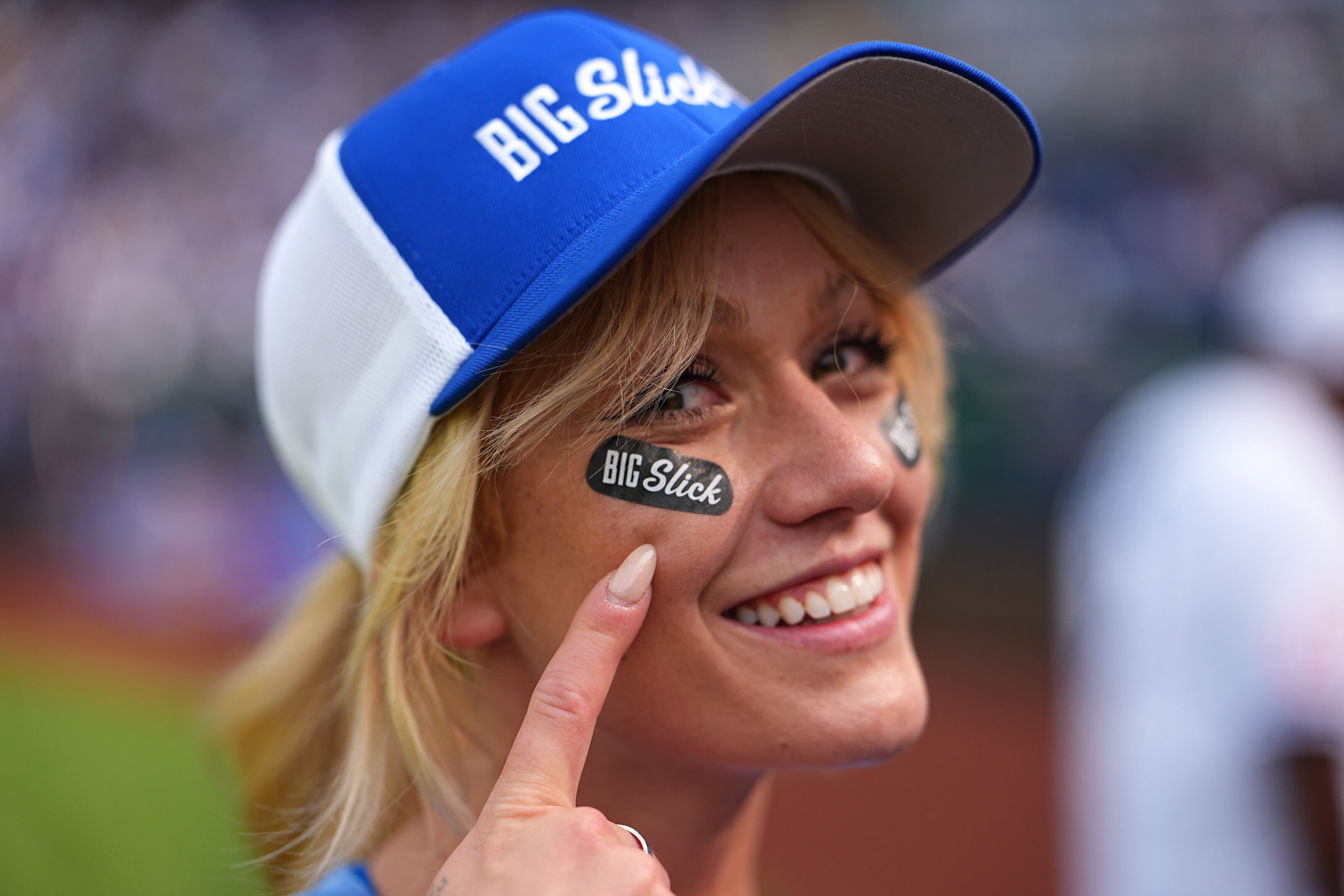 kansas-city-event-photography-0258-woman-smiling-in-royals-cap