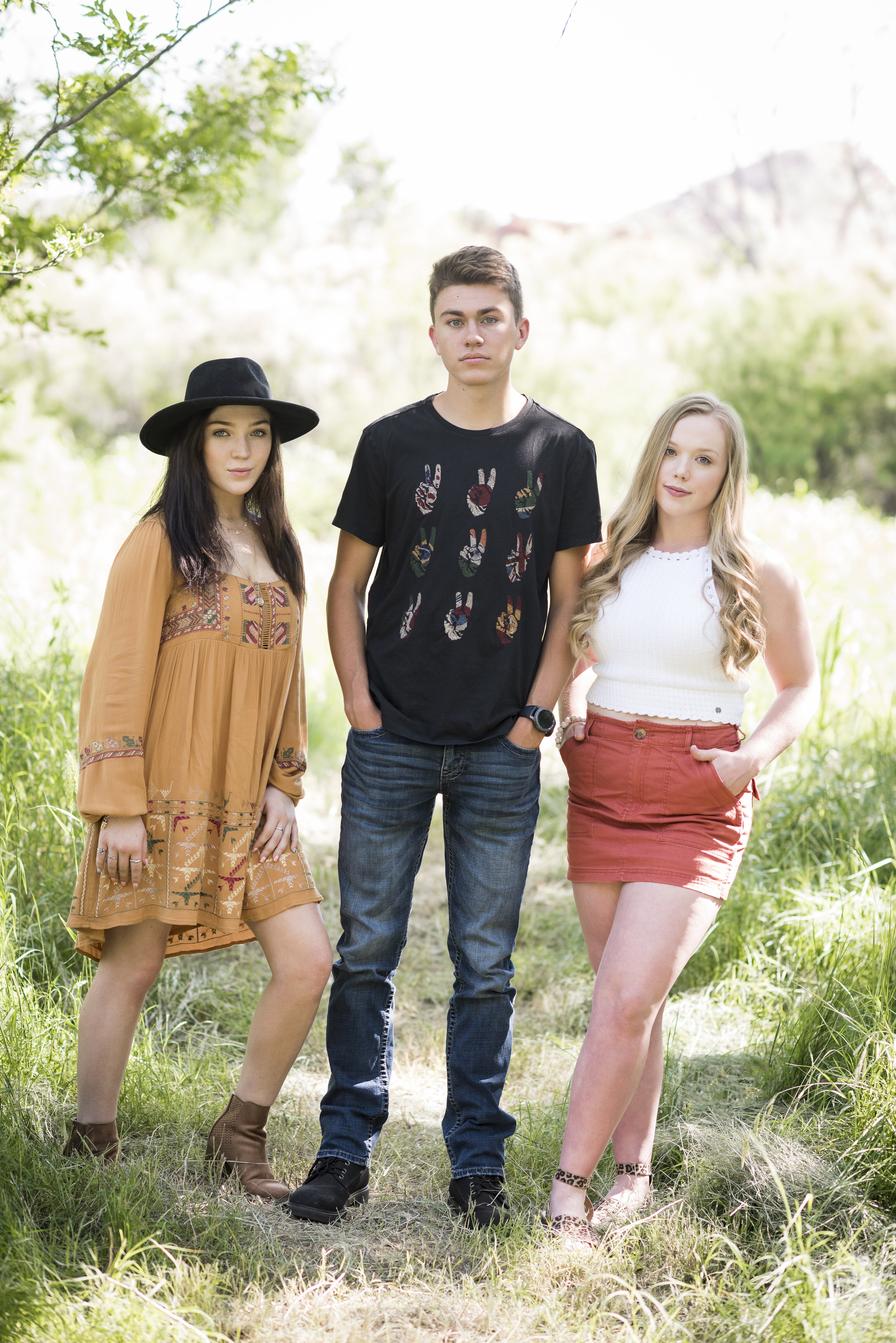 3 high school seniors take a picture together in Palo Duro Canyon