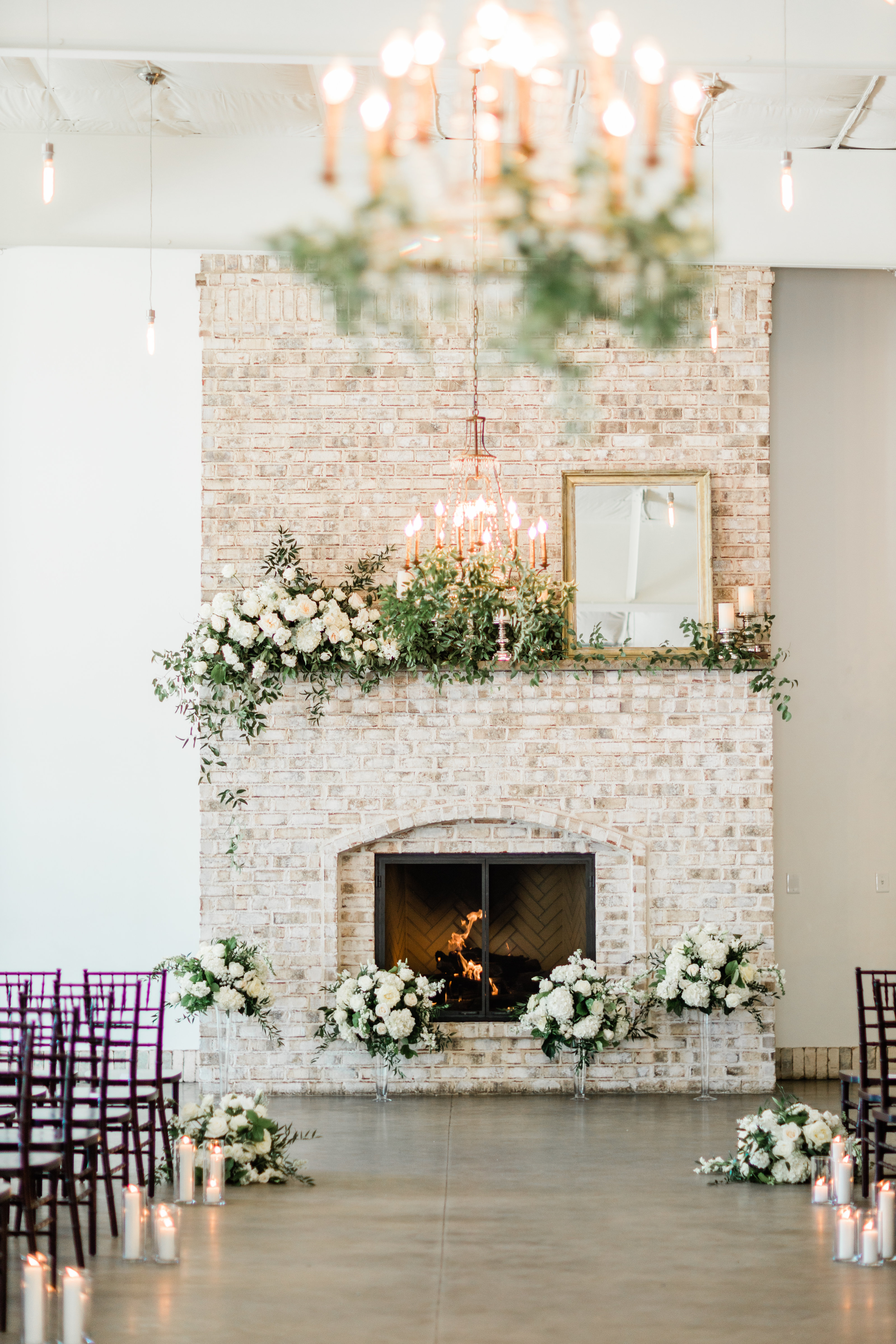 The fireplace at Wrightsville Manor beautifully done up for a wedding