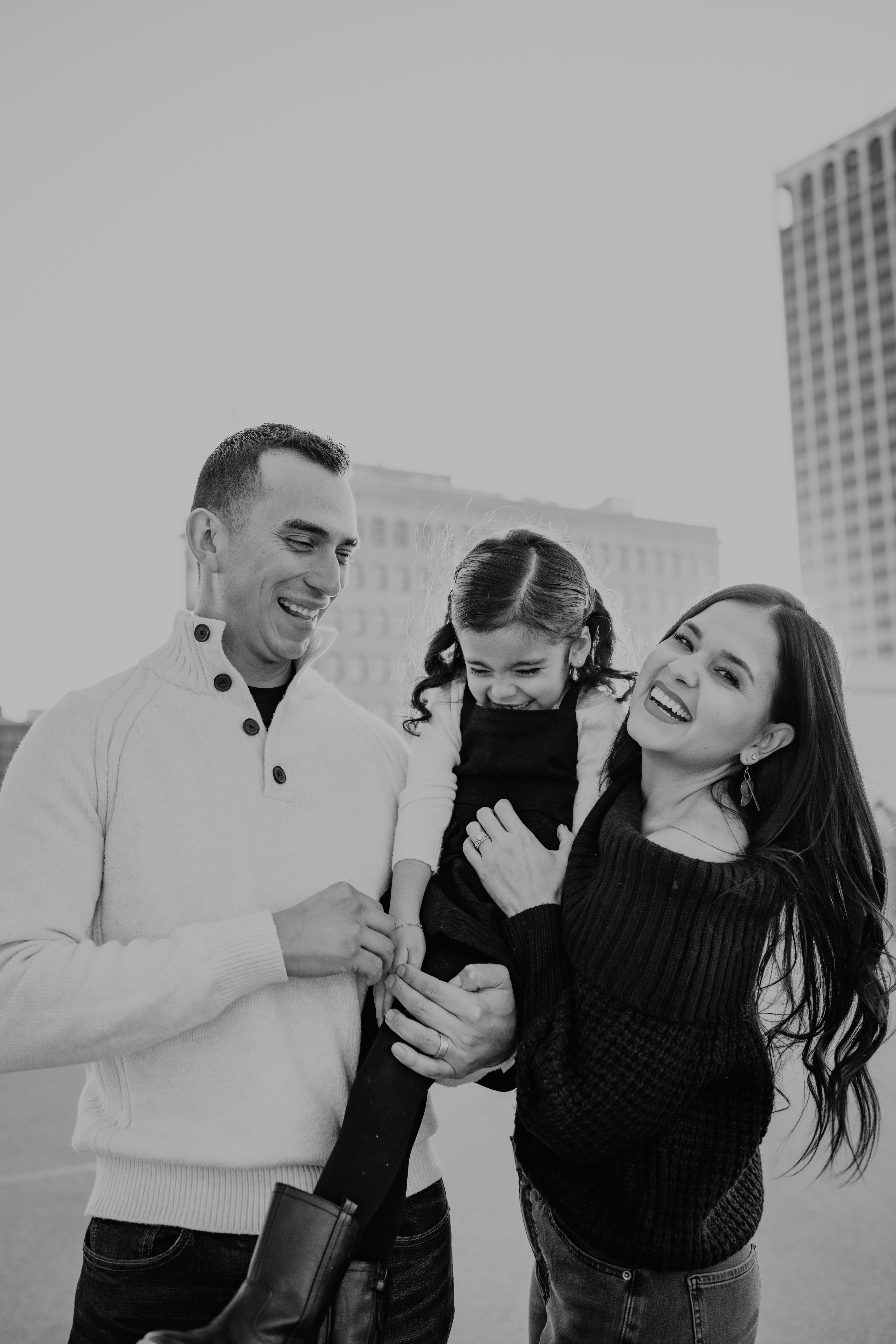 family smiling happy in downtown amarillo texas, amarillo texas family photographer