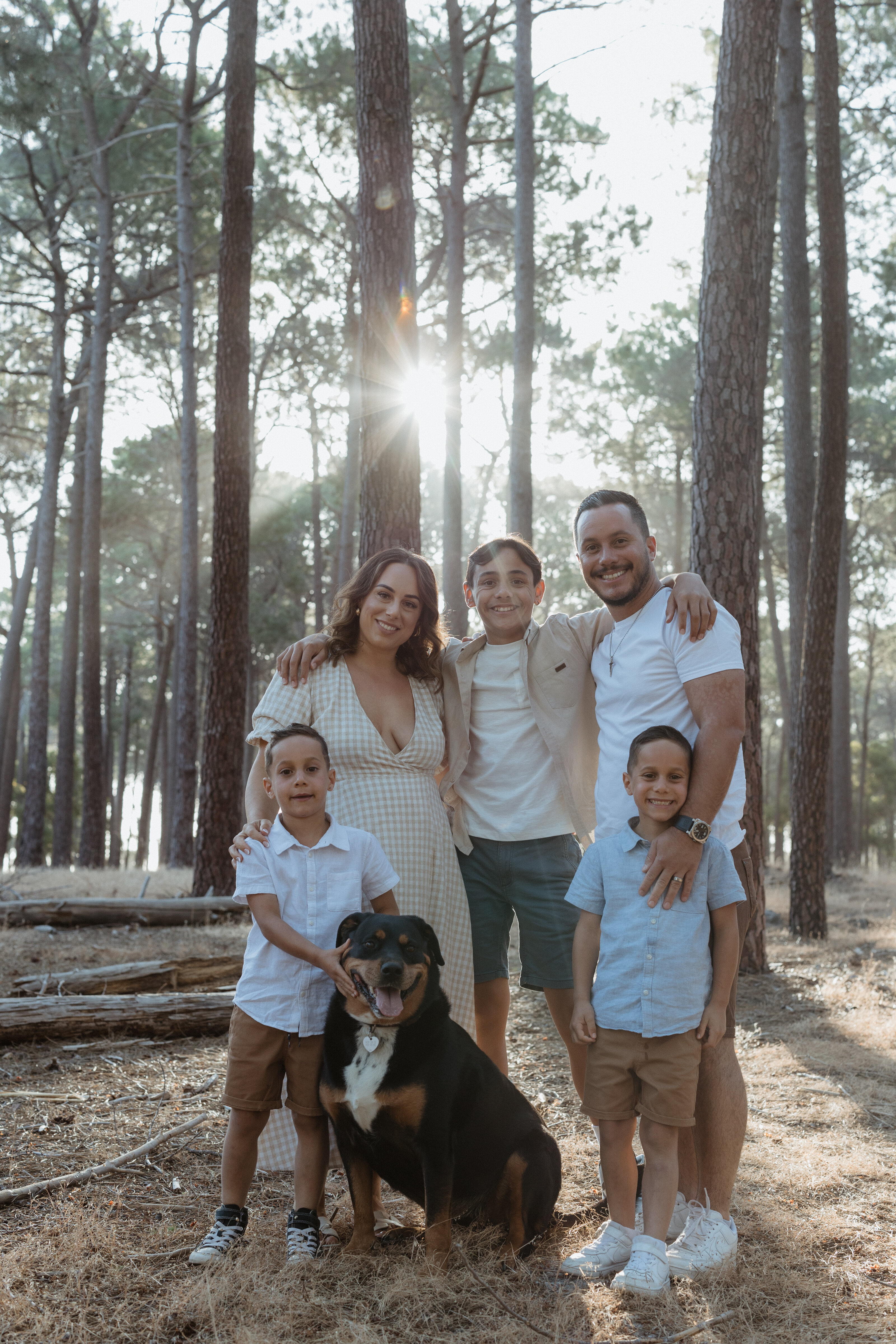 Parents and children embracing in a warm family portrait in Perth