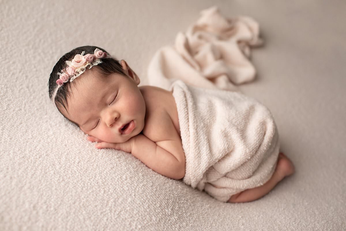Sleeping baby girl with cream floral headband for newborn photography columbia md photos