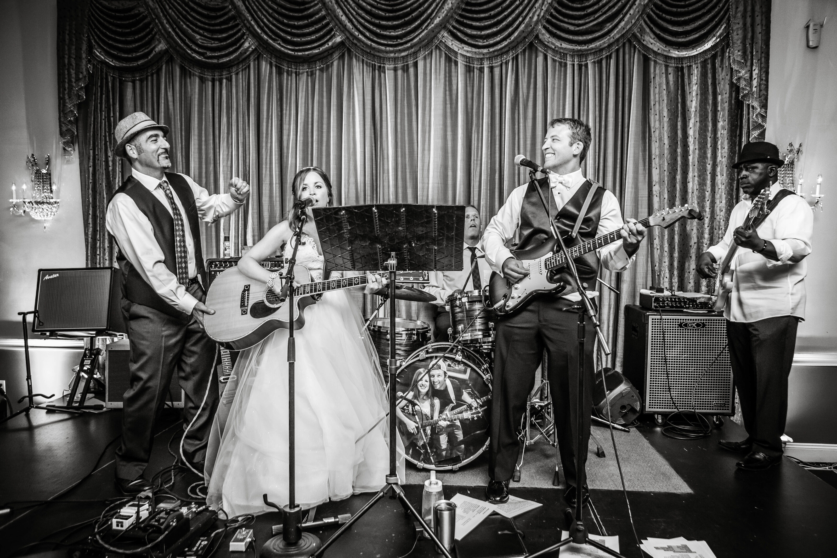 bride and groom sing for reception photos on wedding day in New Jersey