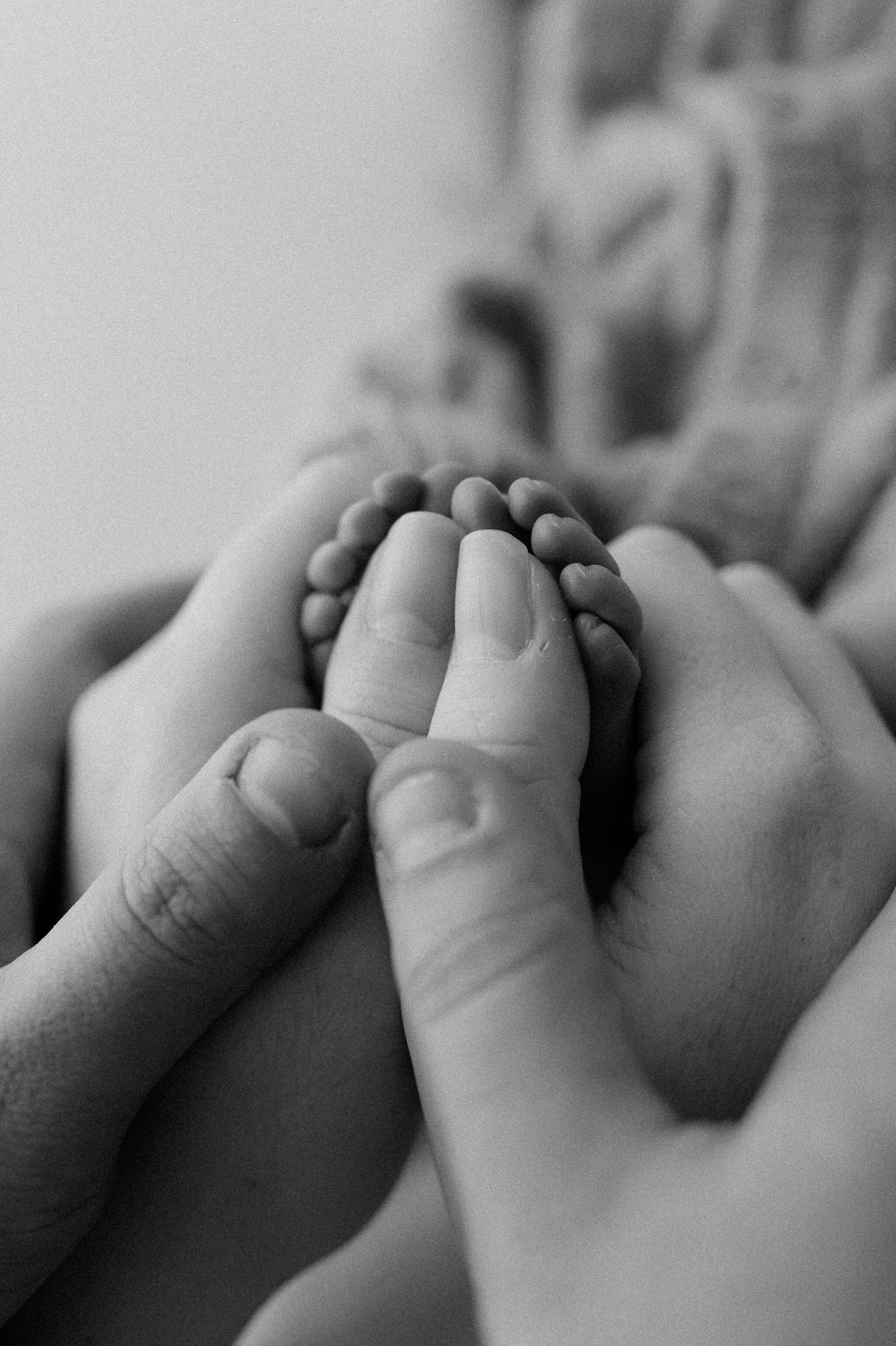 Mum, Dad and newborn baby hands taken at York photography studio in central York