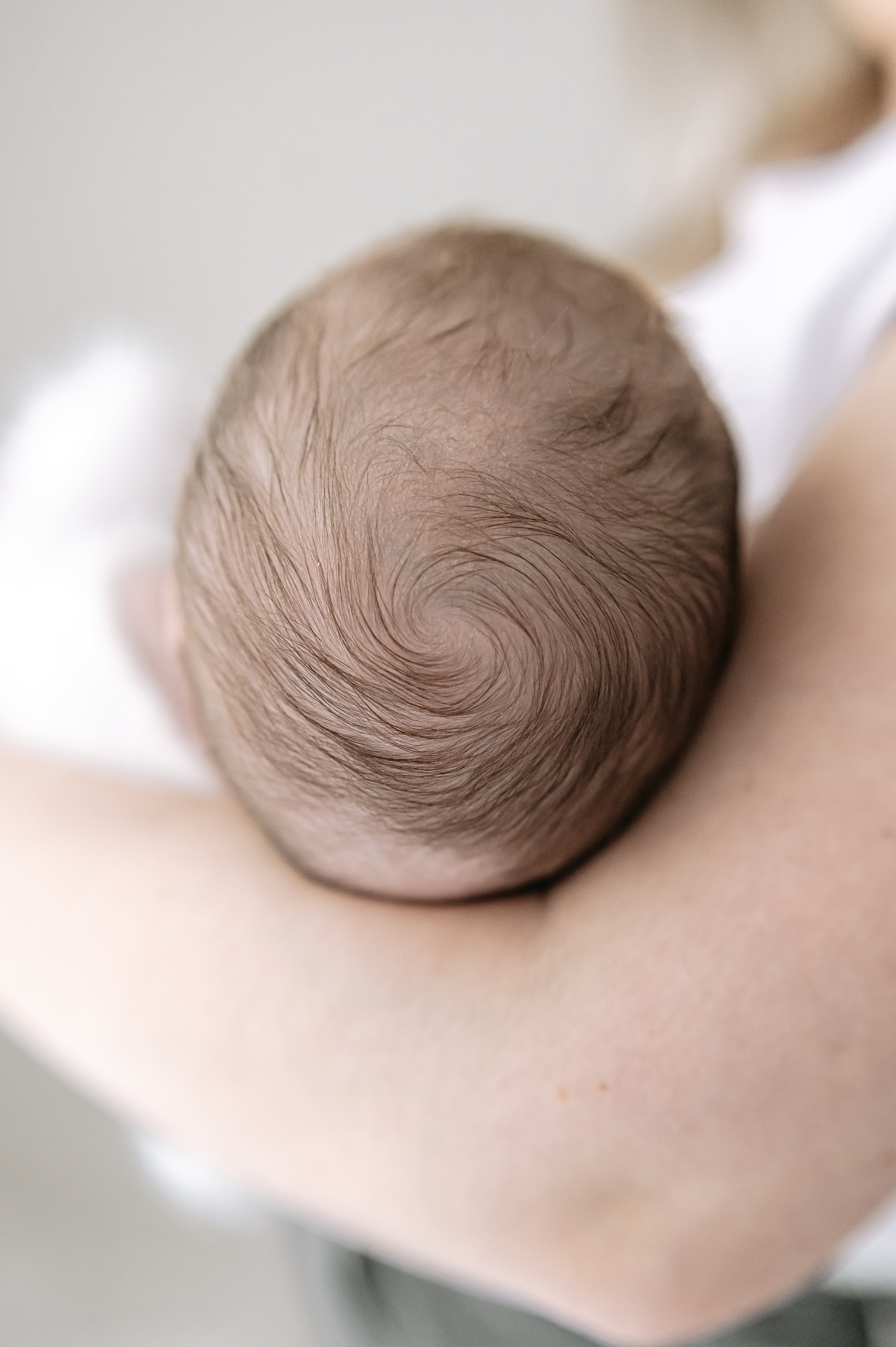 overhead shot of newborn baby at newborn photography studio in central York near me close up of babies head