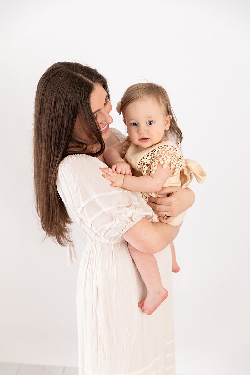 Mom holding baby girl for her milestone portraits by Maryland Portrait Photographer : Rebecca Leigh Photography