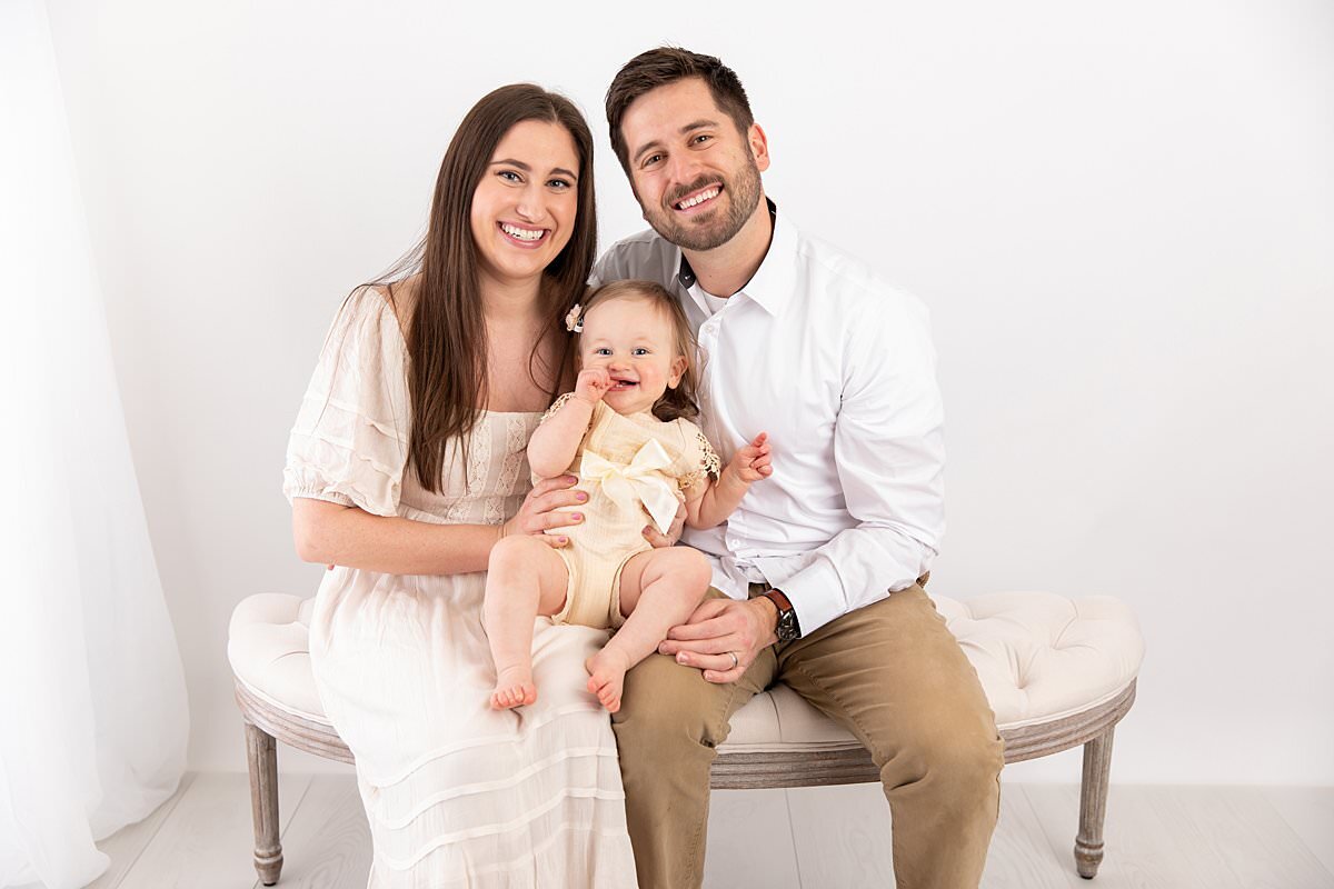 Family portrait on bench in studio by Maryland Portrait Photographer : Rebecca Leigh Photography