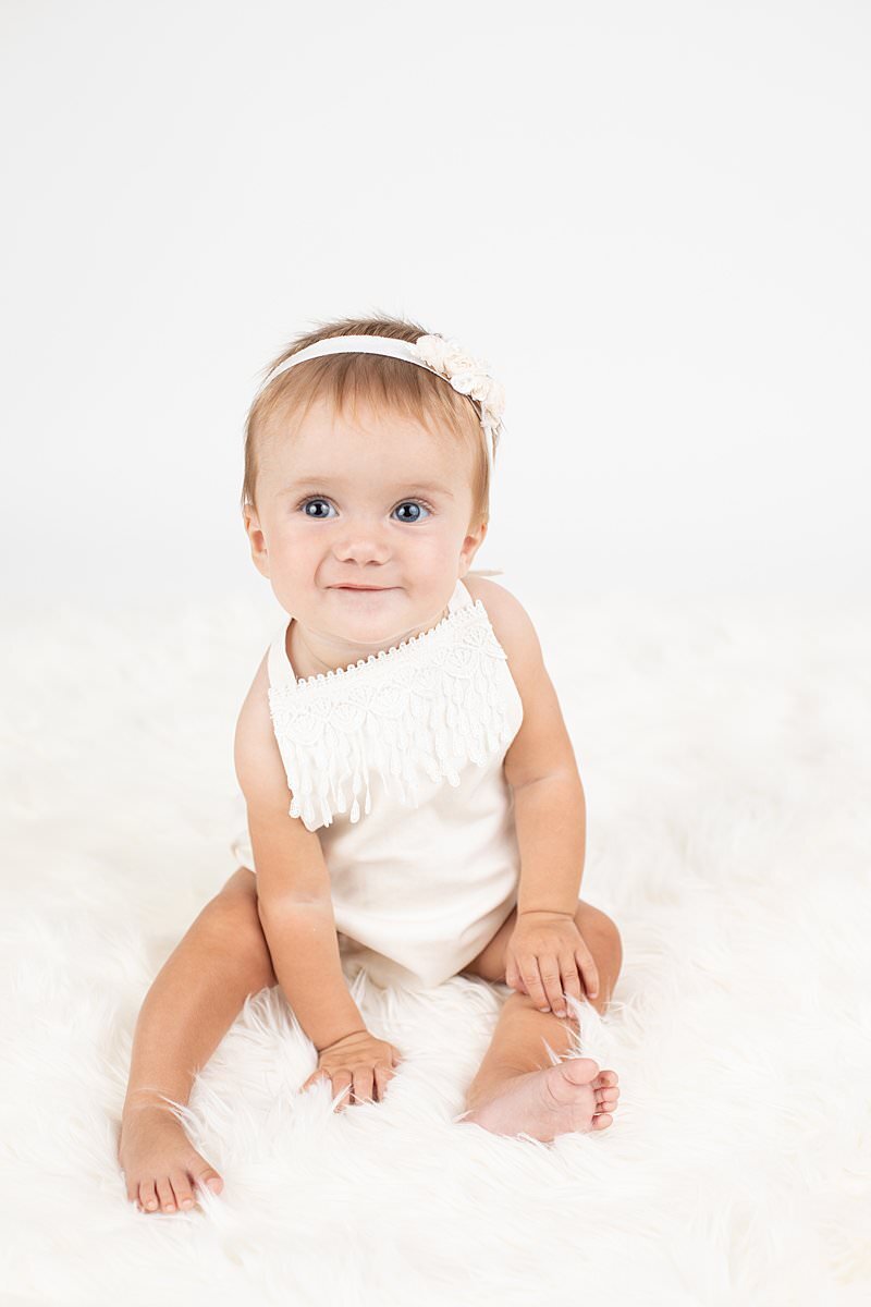 Baby girl sitting for Maryland Portrait Photographer : Rebecca Leigh Photography